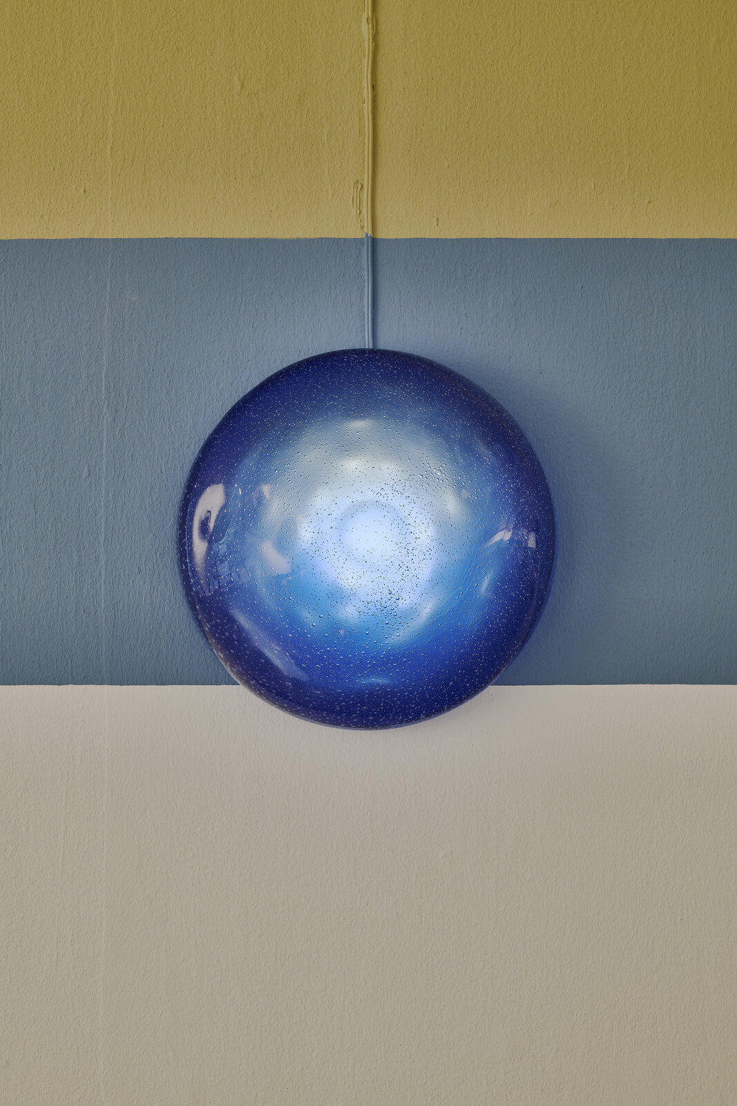 A black and white drawing of a man's face on a wall.