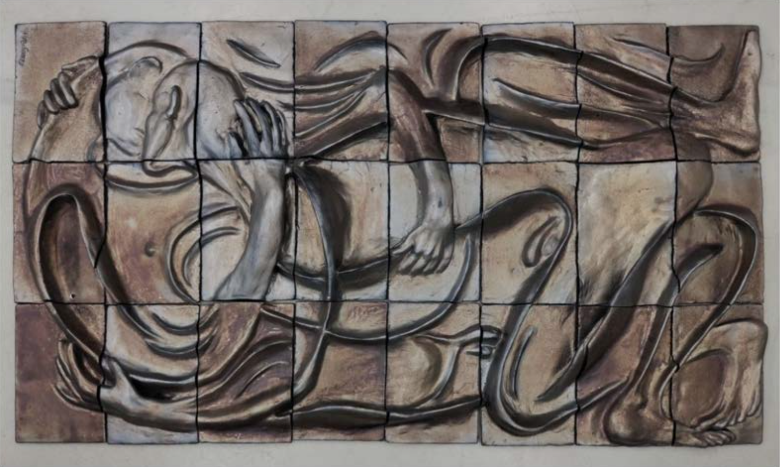 a close up of a piece of art on a wall