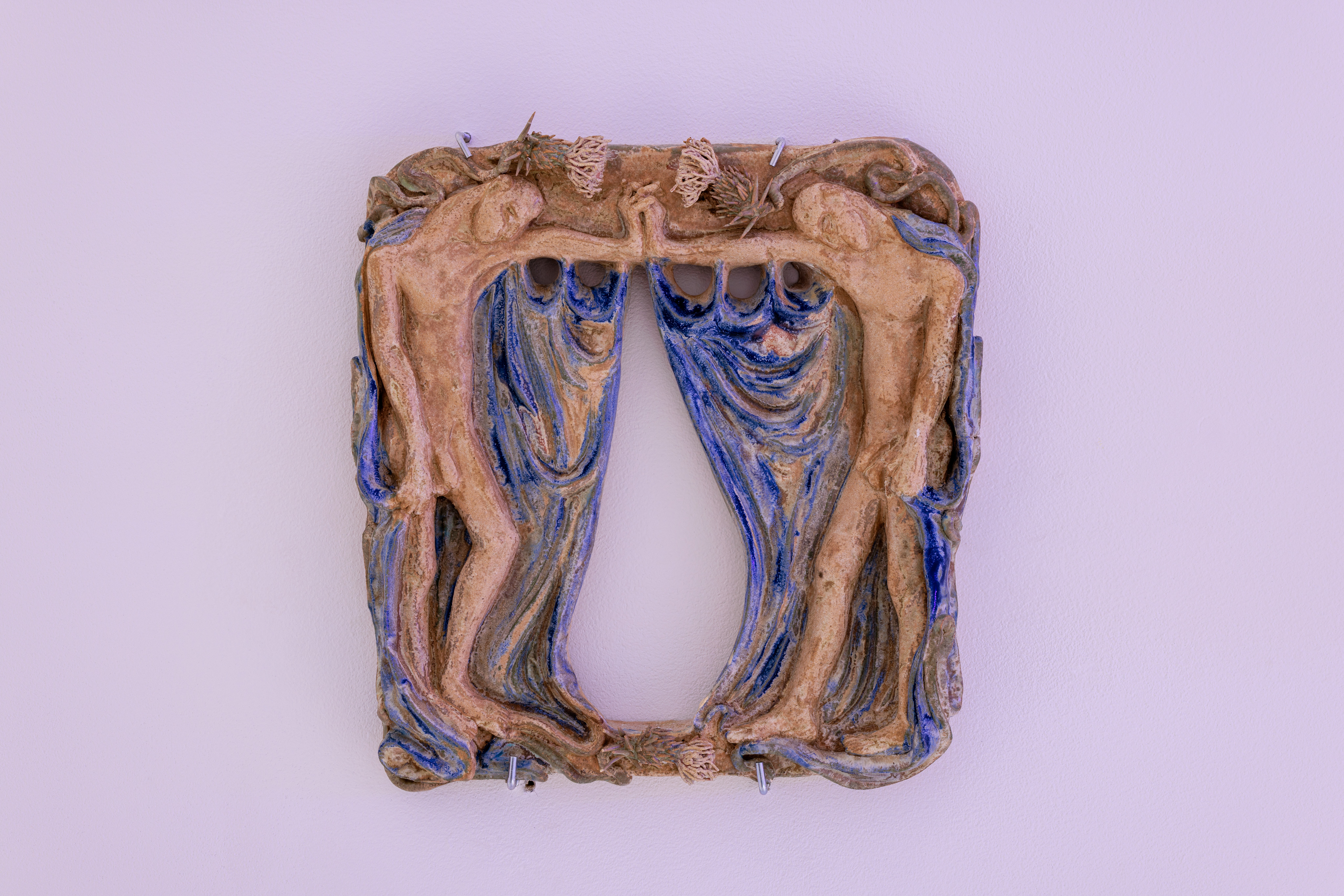 A picture frame with a picture of a man and a woman on it.