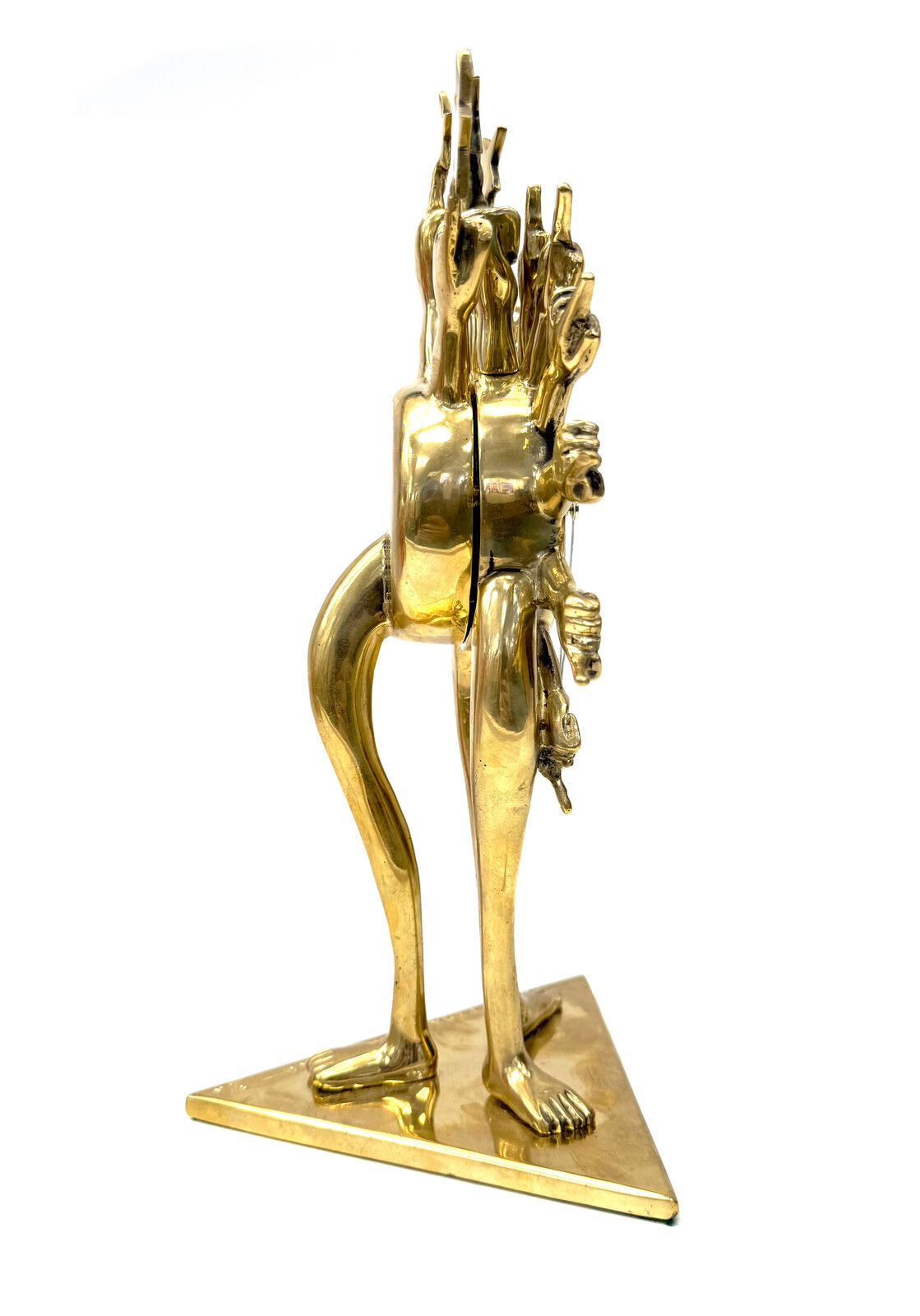 A gold clock with a sun and stars on top of it.