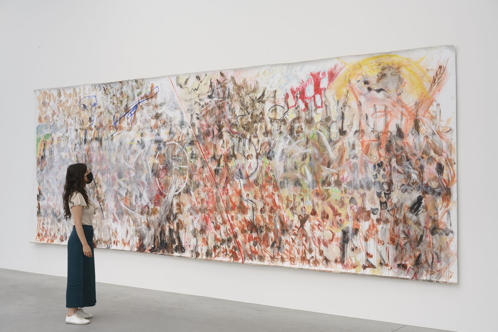 A large painting hanging on a wall in an empty room.