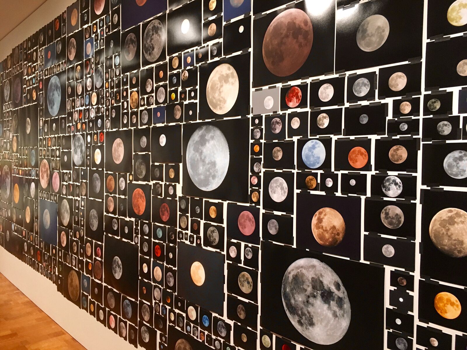 A mosaic of lunar phases and celestial bodies arranged in a dense grid.