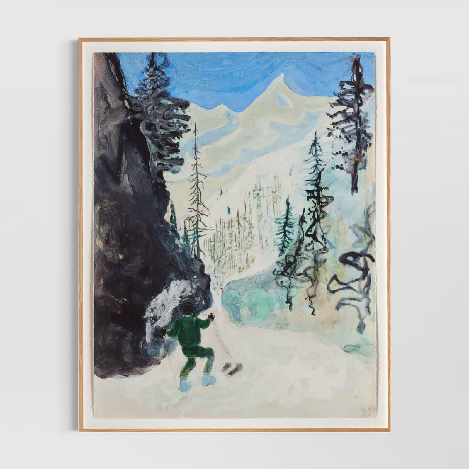 A group of paintings hanging on a wall in a room.