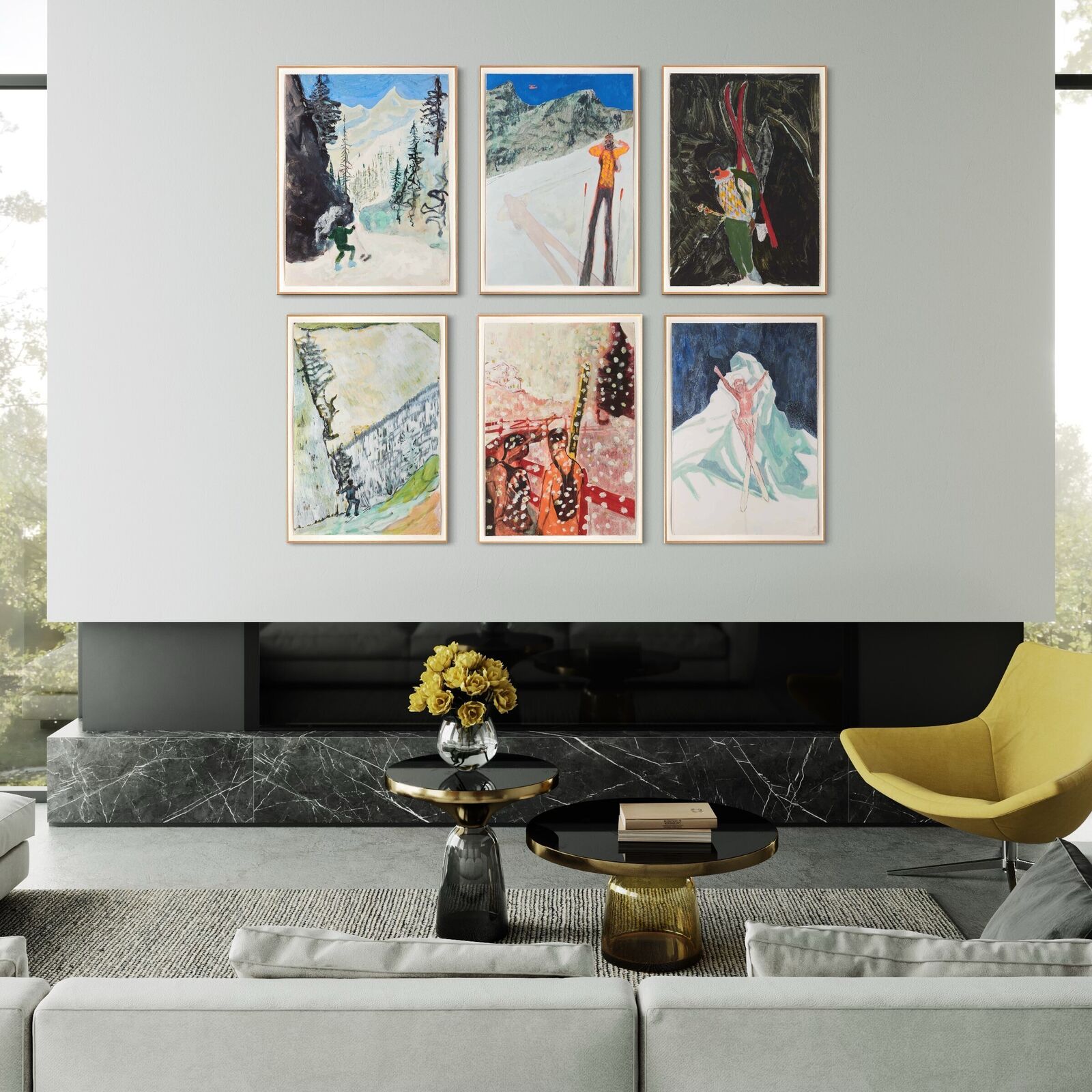 A group of paintings hanging on a wall in a room.