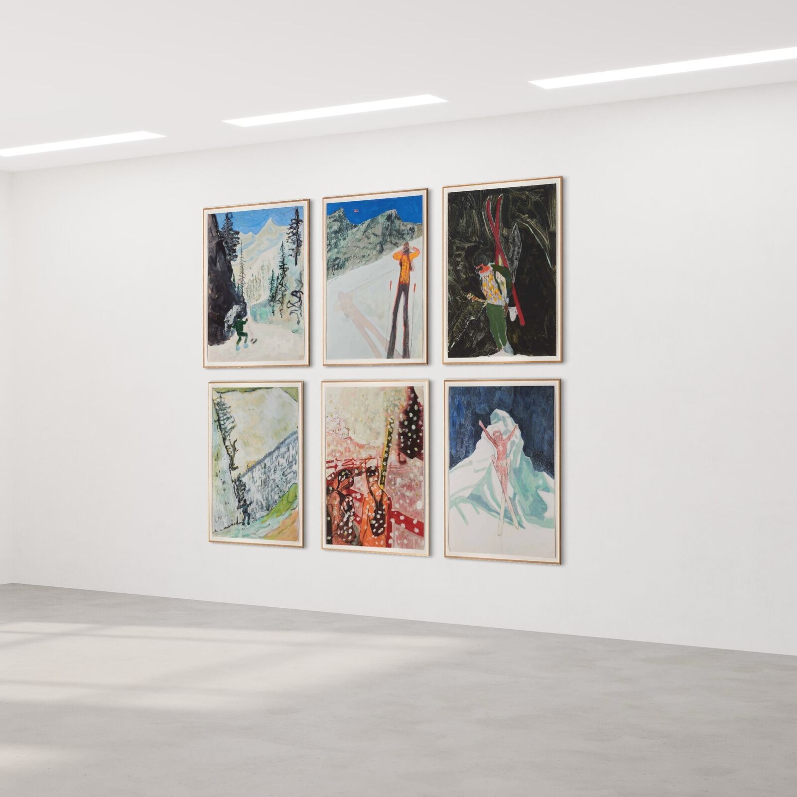 A group of paintings hanging on a wall in a room.