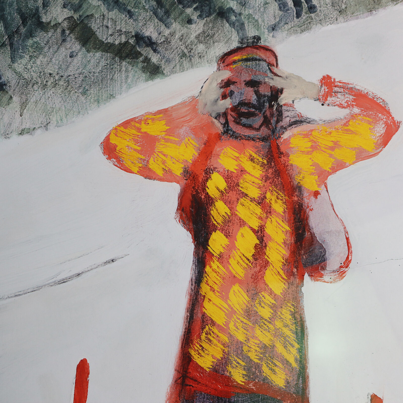 A group of paintings hanging on a wall in a room.