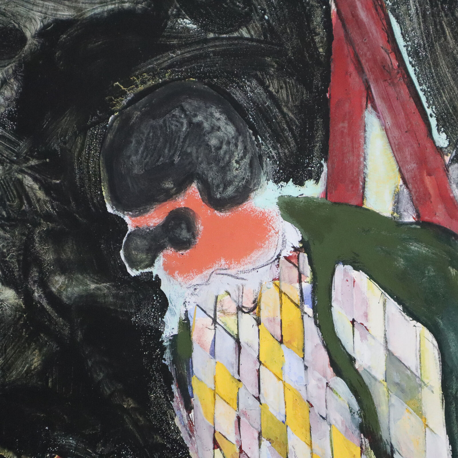 A group of paintings hanging on a wall in a room.