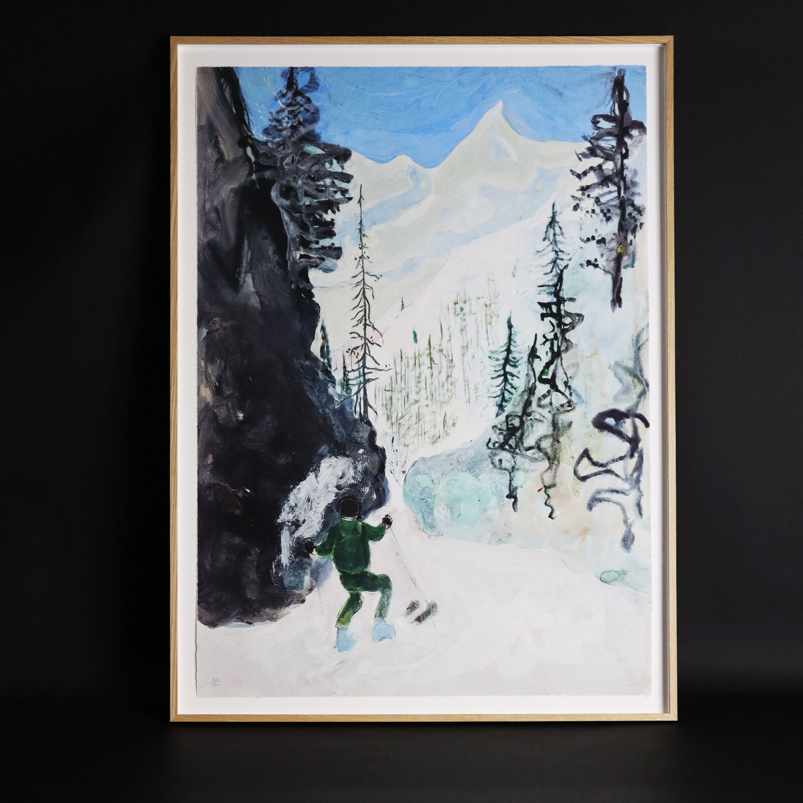 A group of paintings hanging on a wall in a room.