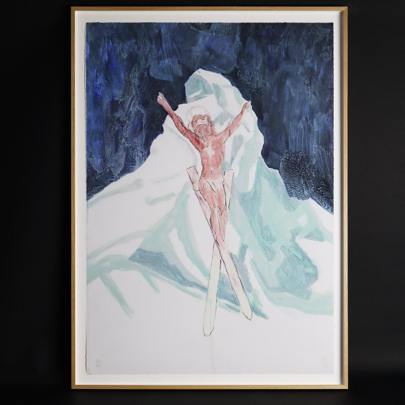 A group of paintings hanging on a wall in a room.