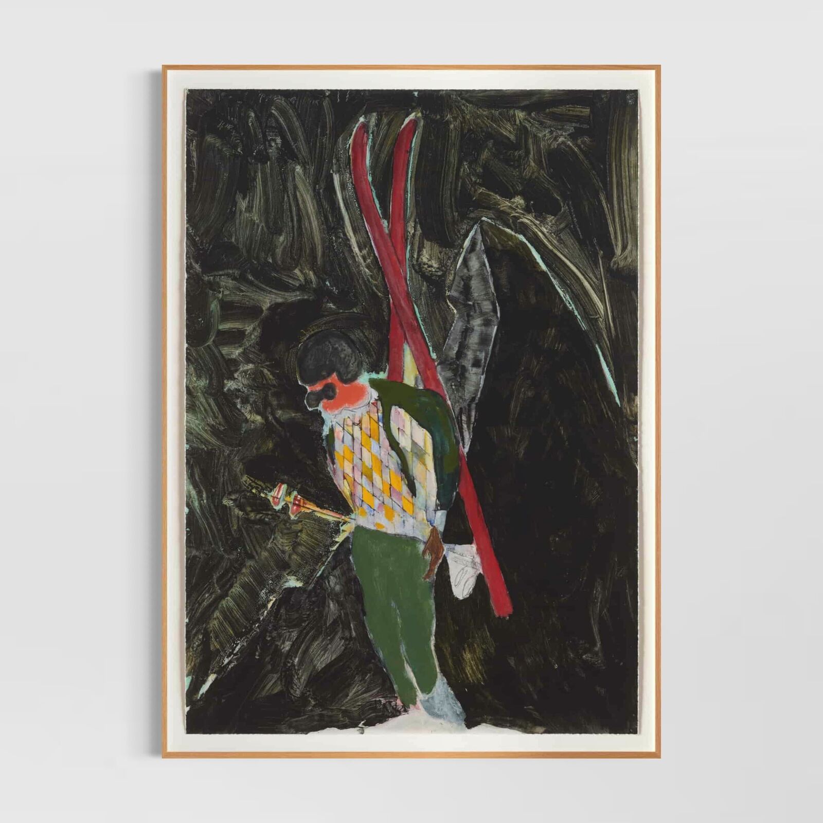 A group of paintings hanging on a wall in a room.