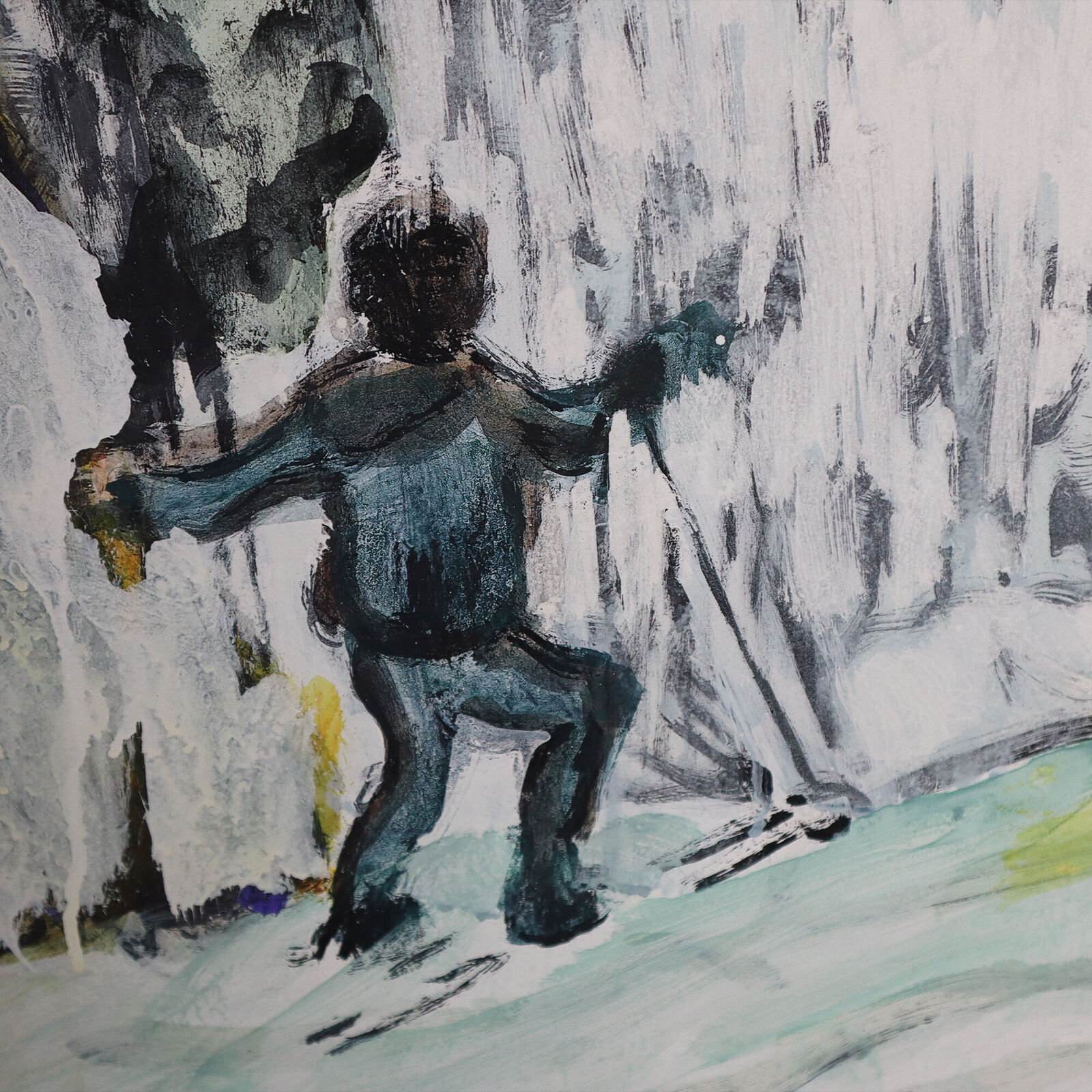 A group of paintings hanging on a wall in a room.