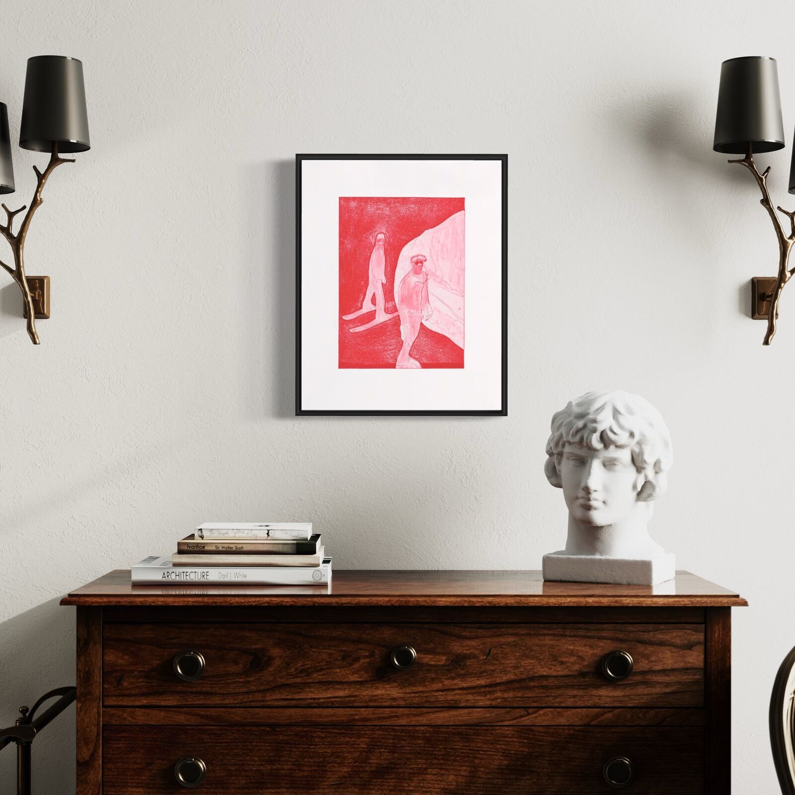 A framed print featuring two stylized figures in a red-toned landscape.