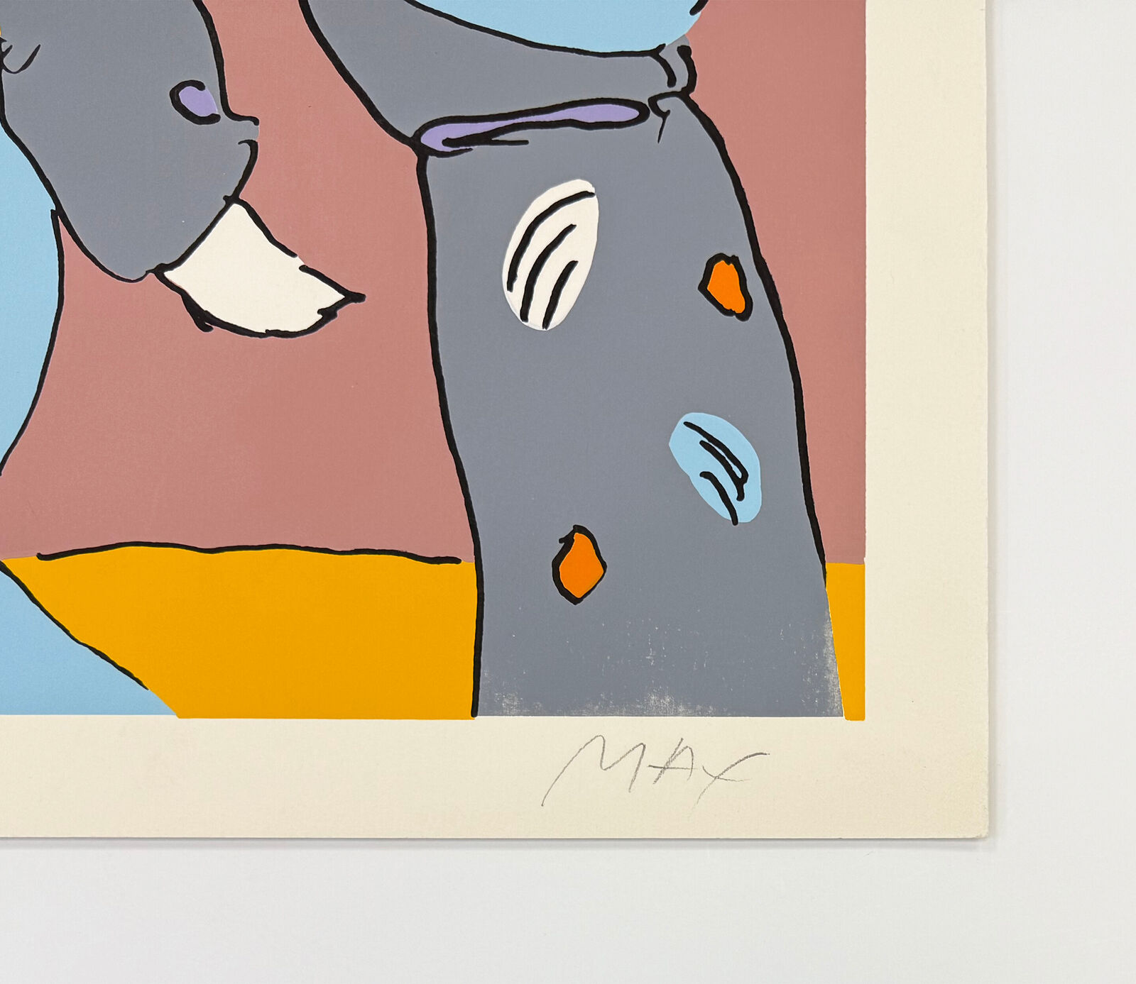 A framed print of two people walking in the desert.