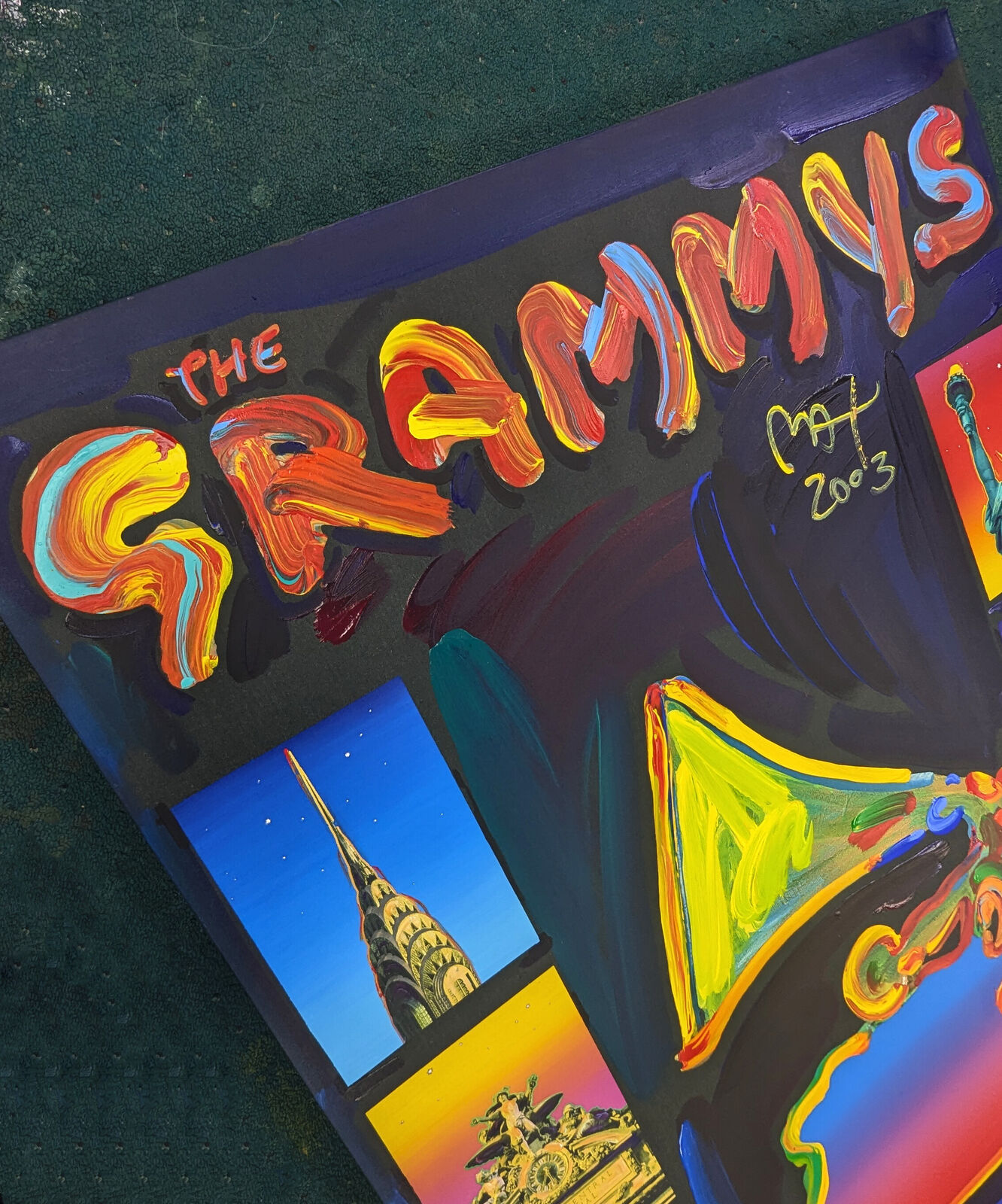 A painting of a grammy award in front of a city skyline.