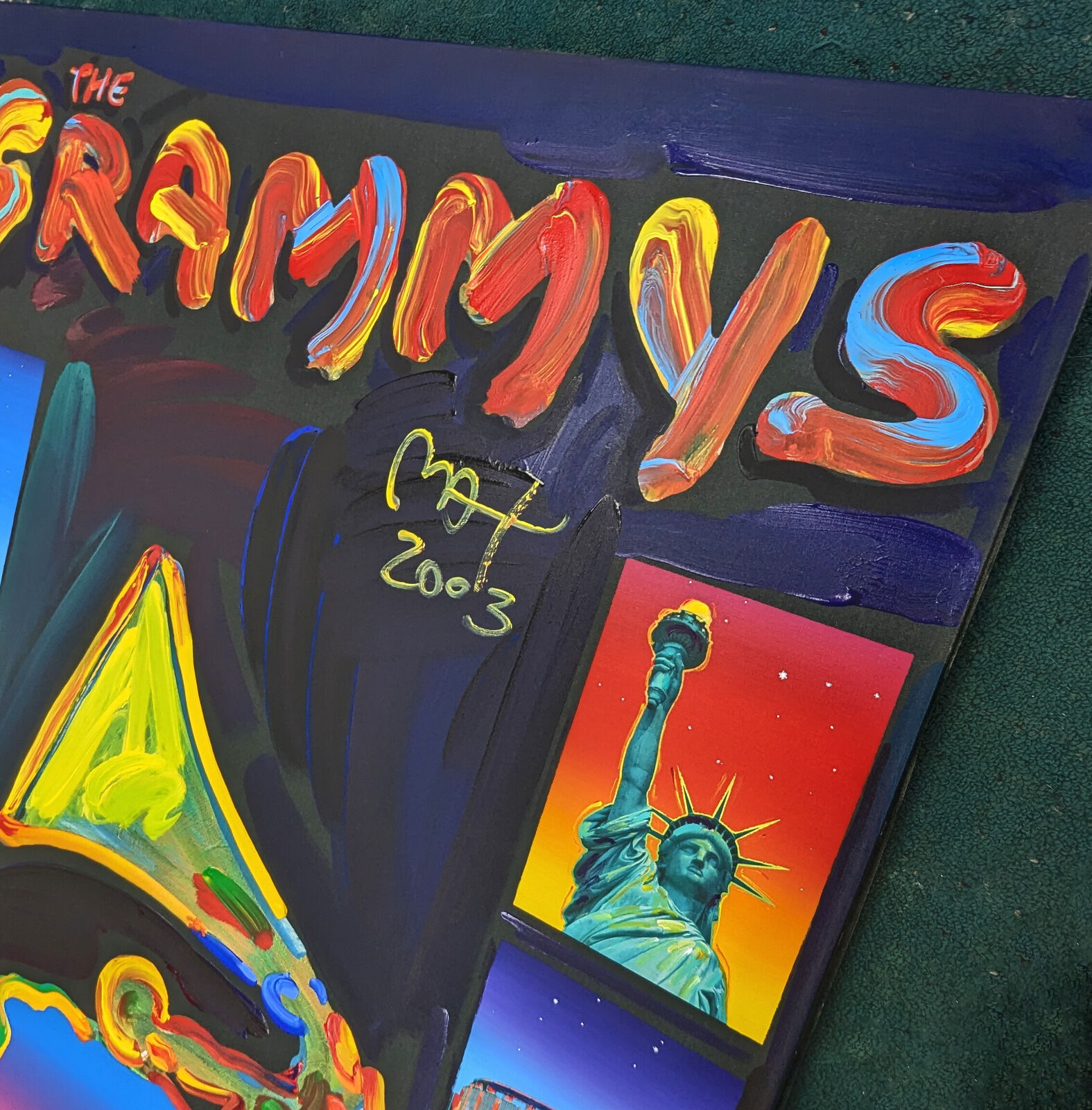 A painting of a grammy award in front of a city skyline.