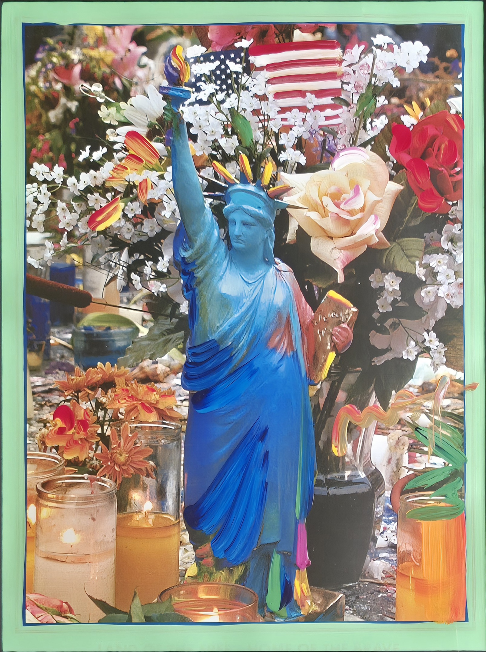 A statue of liberty surrounded by flowers and candles.