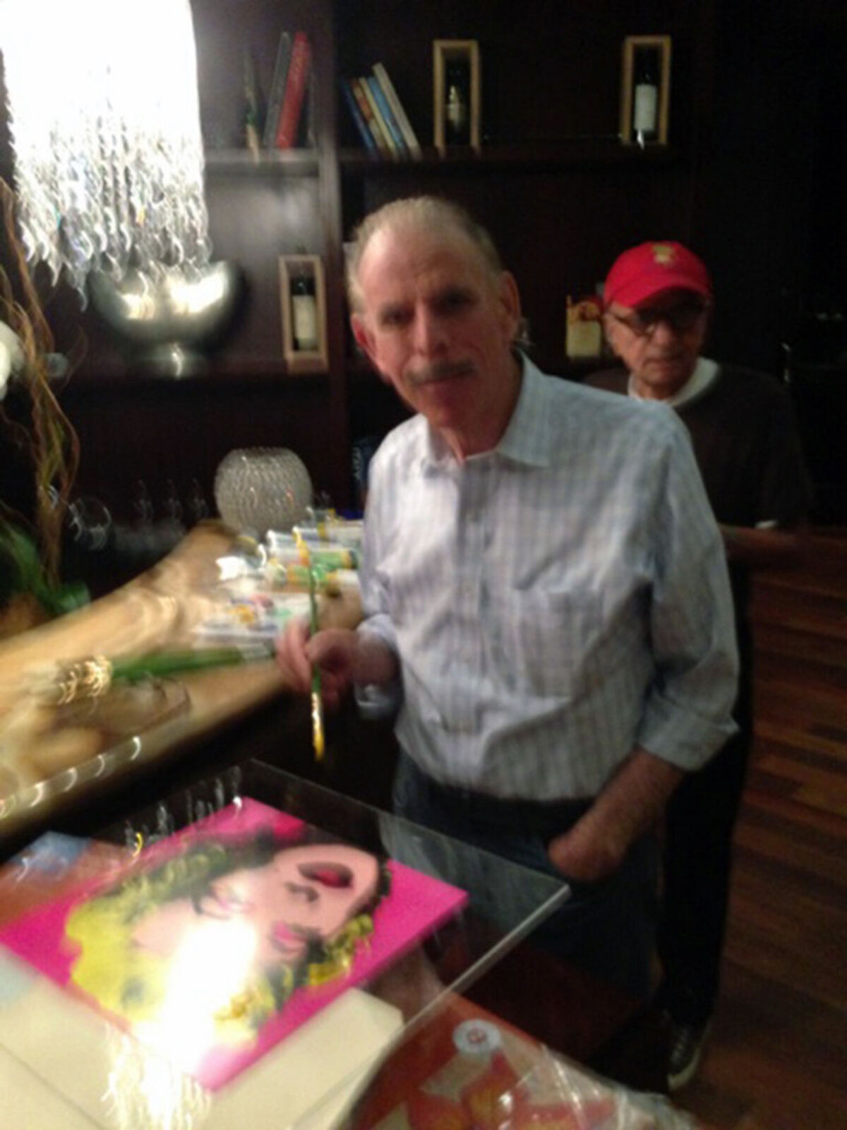 A drawing of a woman's face with flowers in a vase.