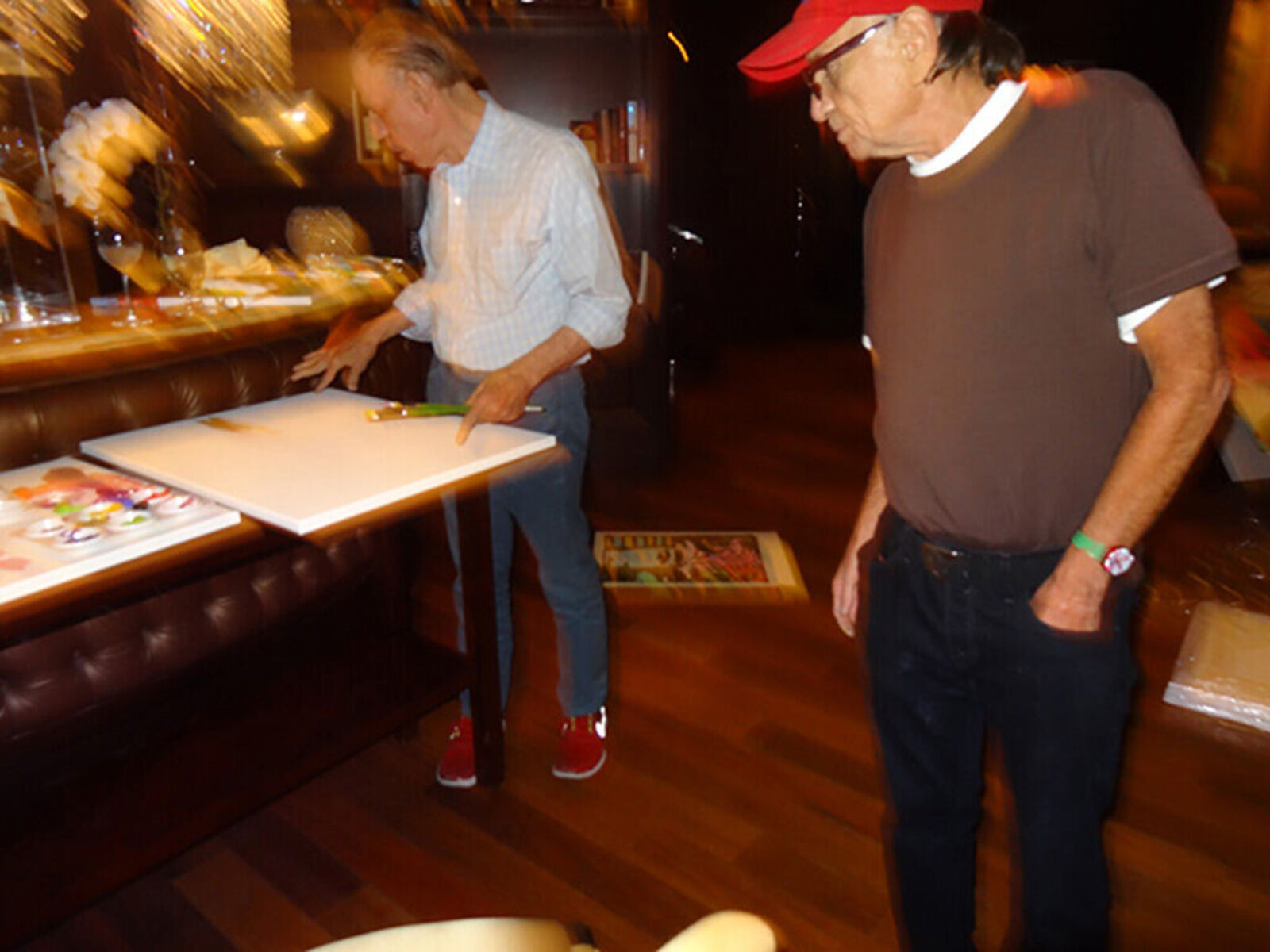 A painting of a woman's face with hearts on it.