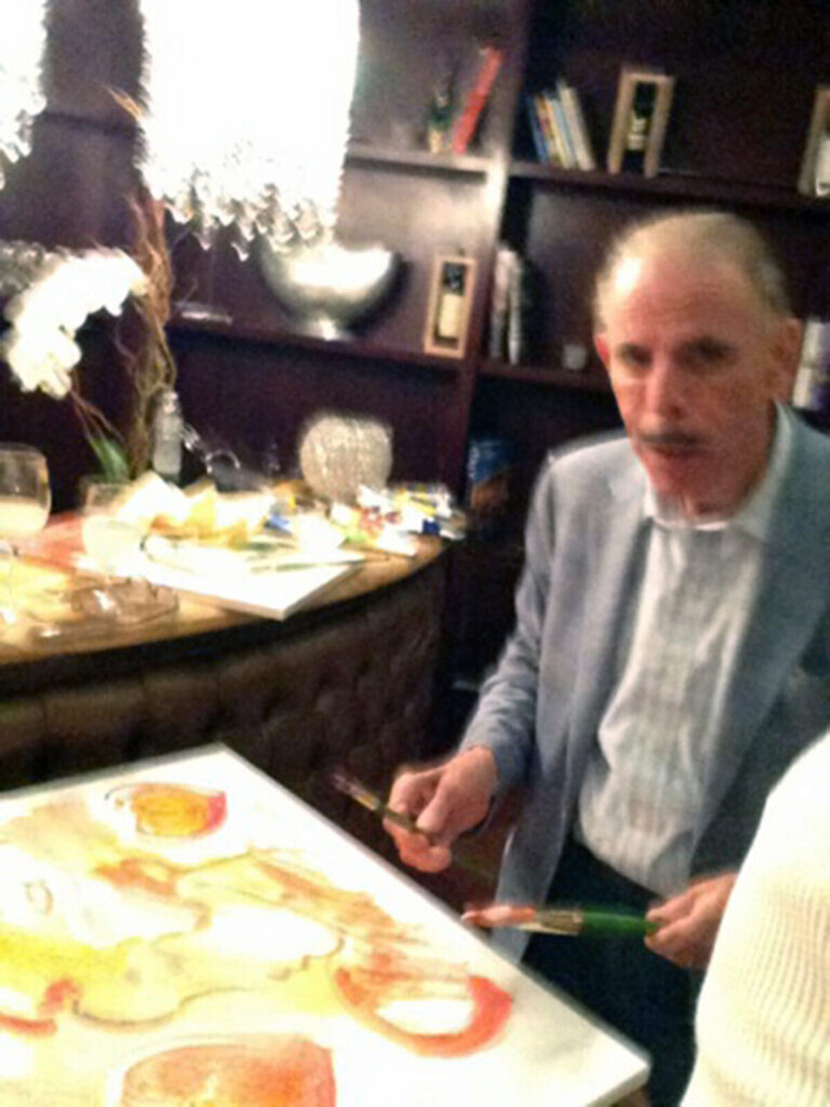 A painting of a woman's face with hearts on it.