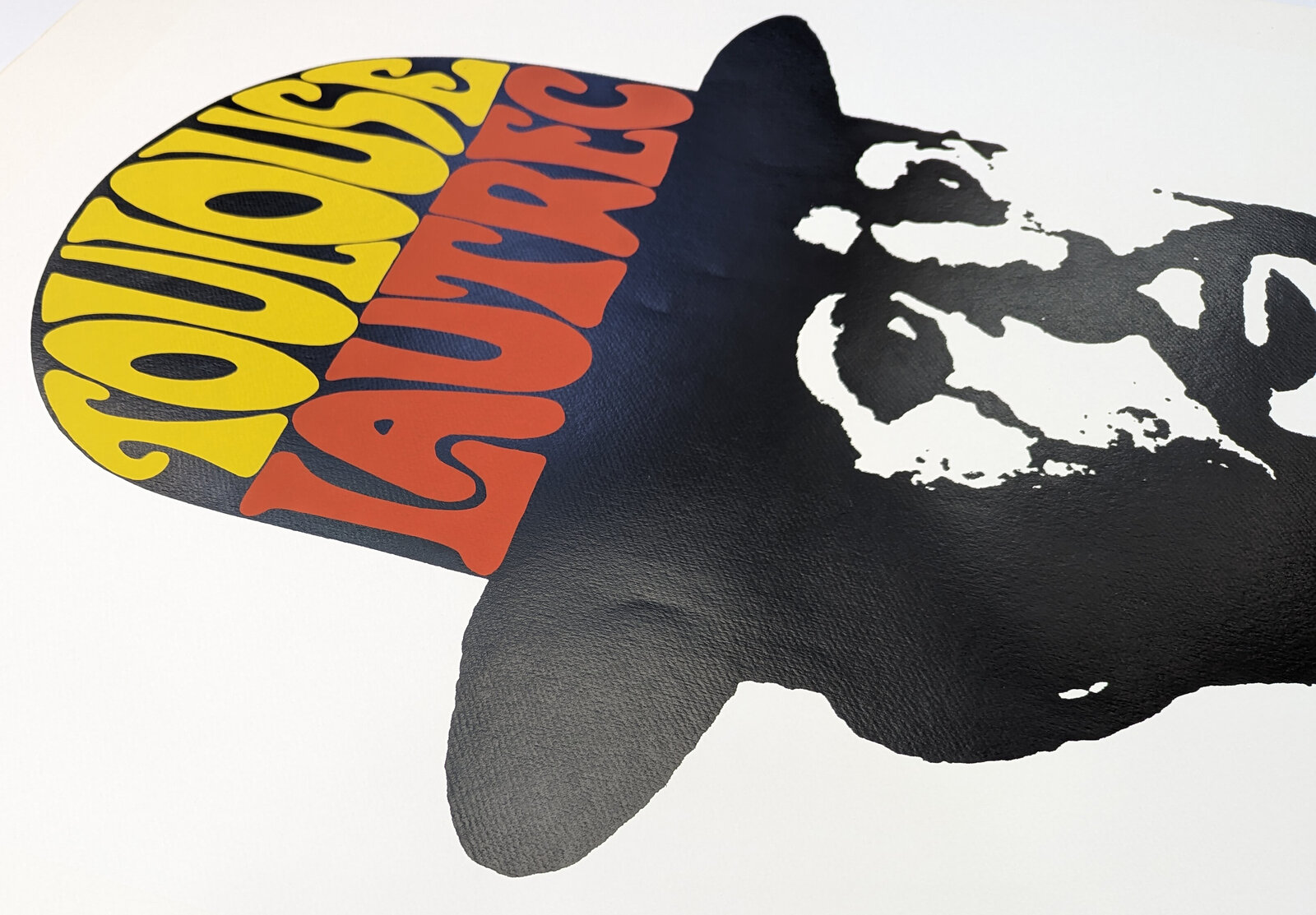 A bold graphic portrait of a bearded figure in silhouette wearing a bowler hat with colorful text.