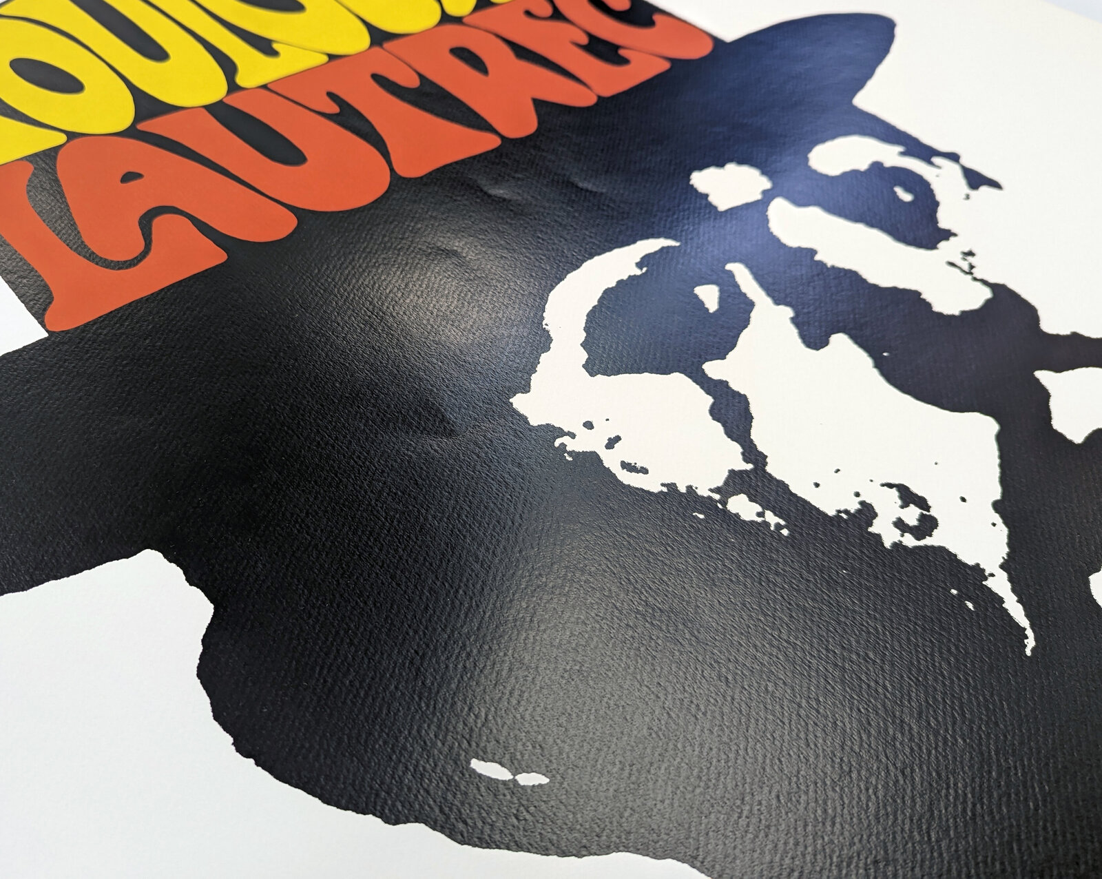 A bold graphic portrait of a bearded figure in silhouette wearing a bowler hat with colorful text.