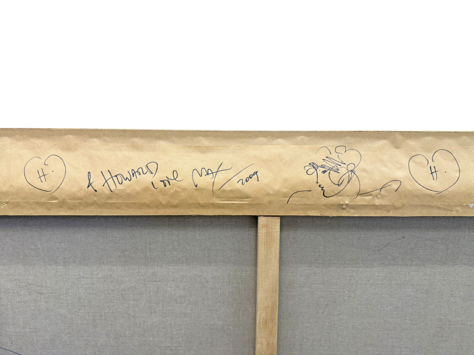 A painting of a man and a woman in a gold frame.