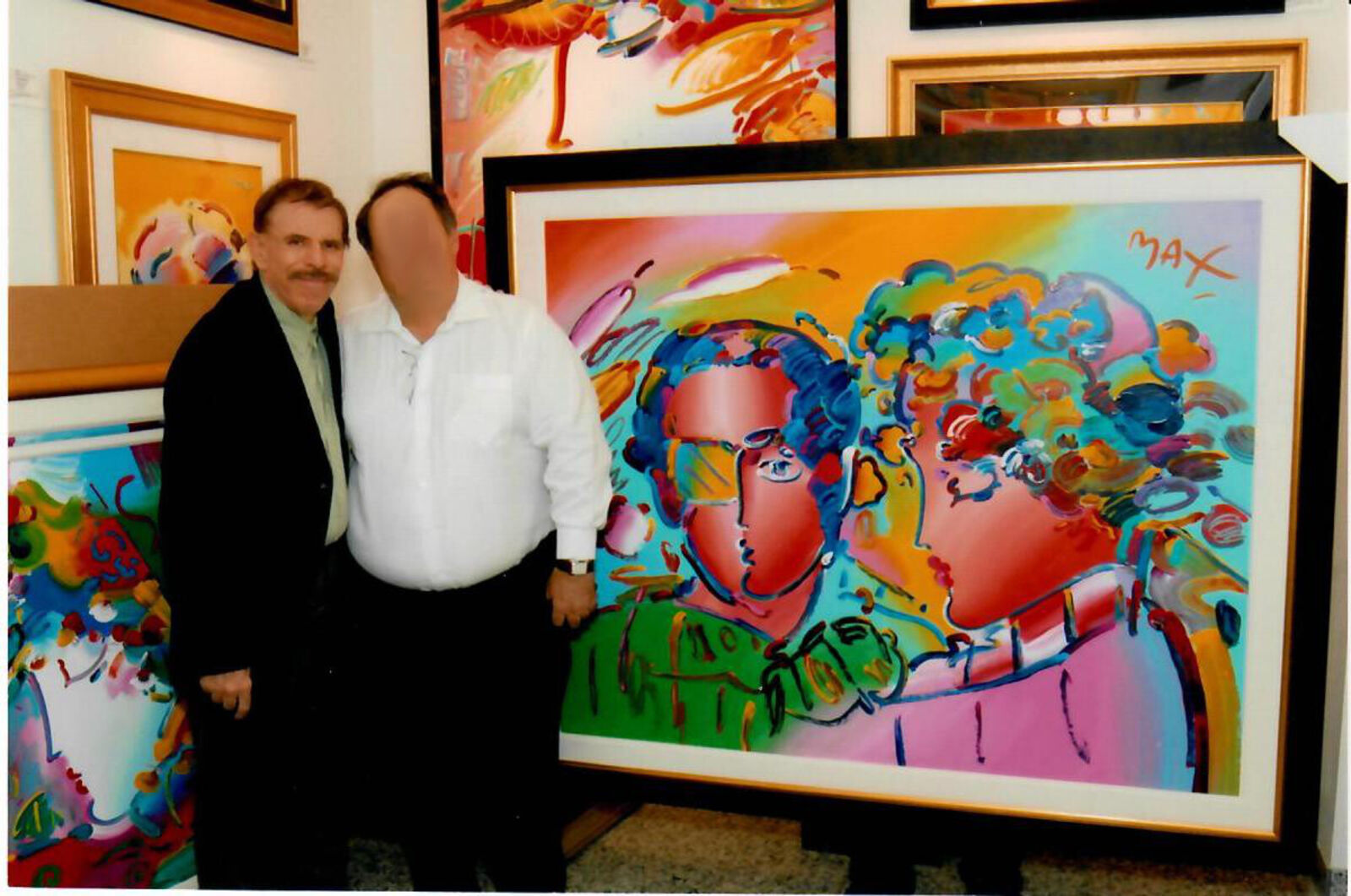 A painting of a man and a woman in a gold frame.