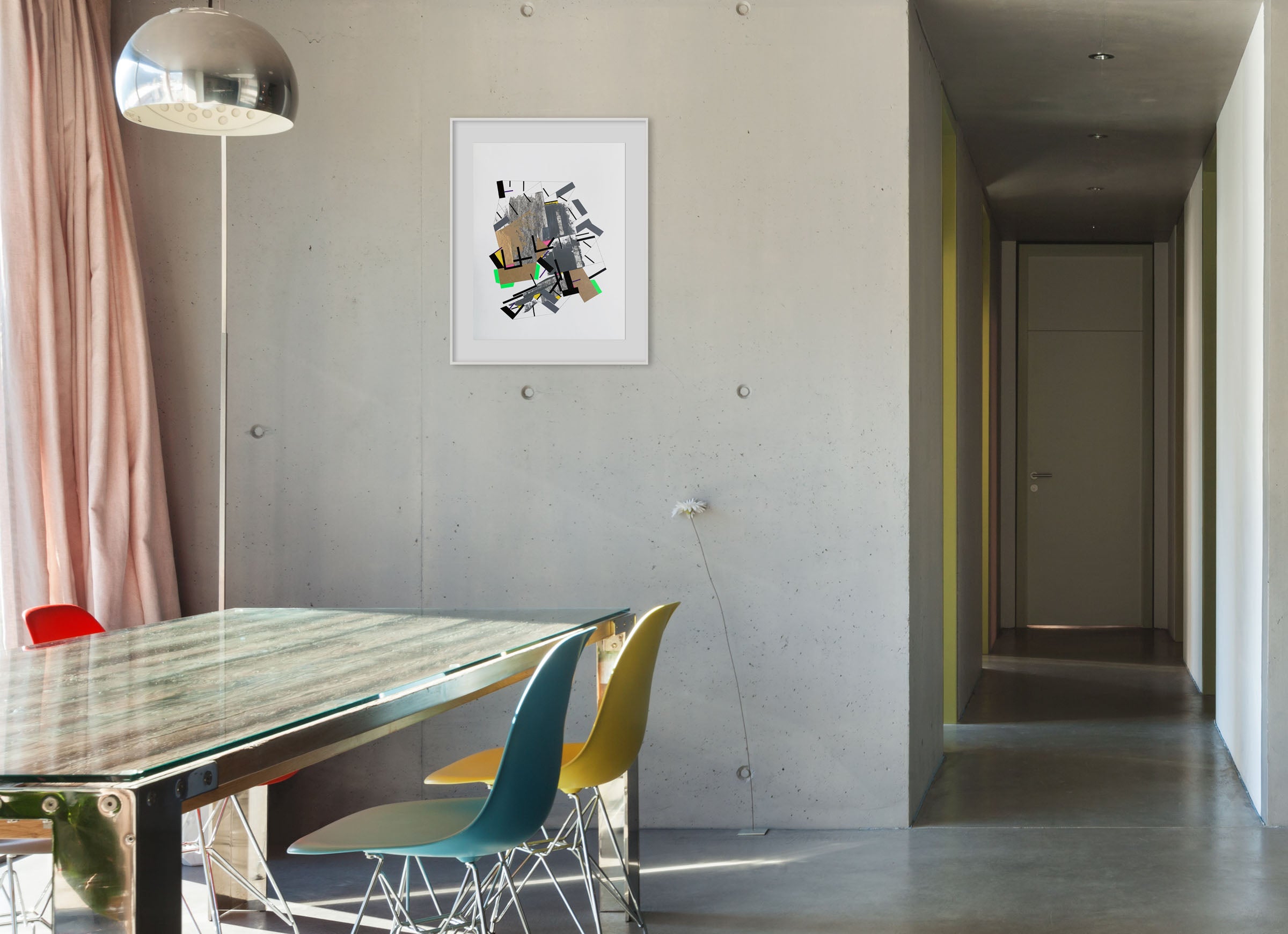 A piece of art that is on a white wall.