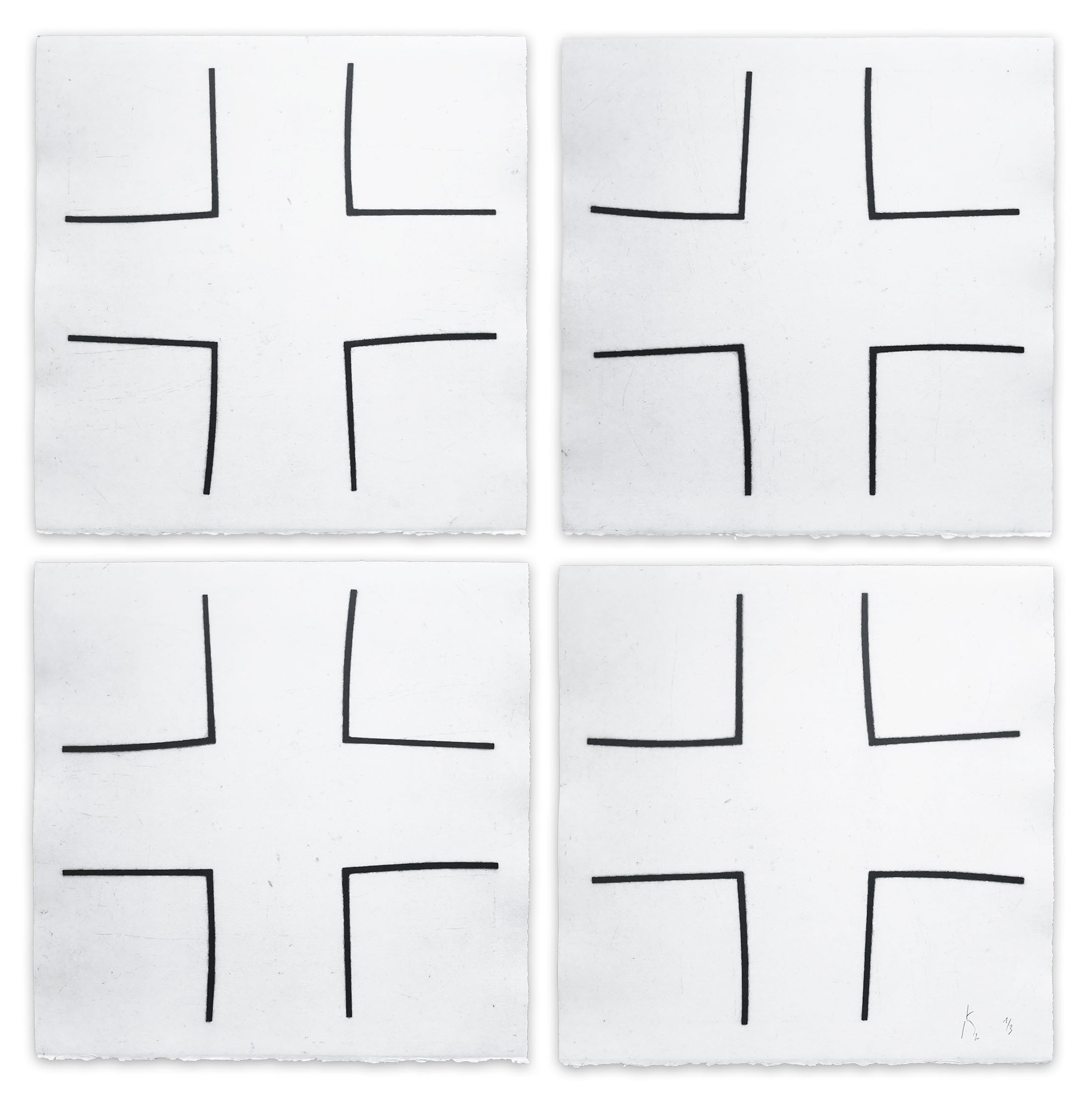 A set of four black and white squares on a white background.