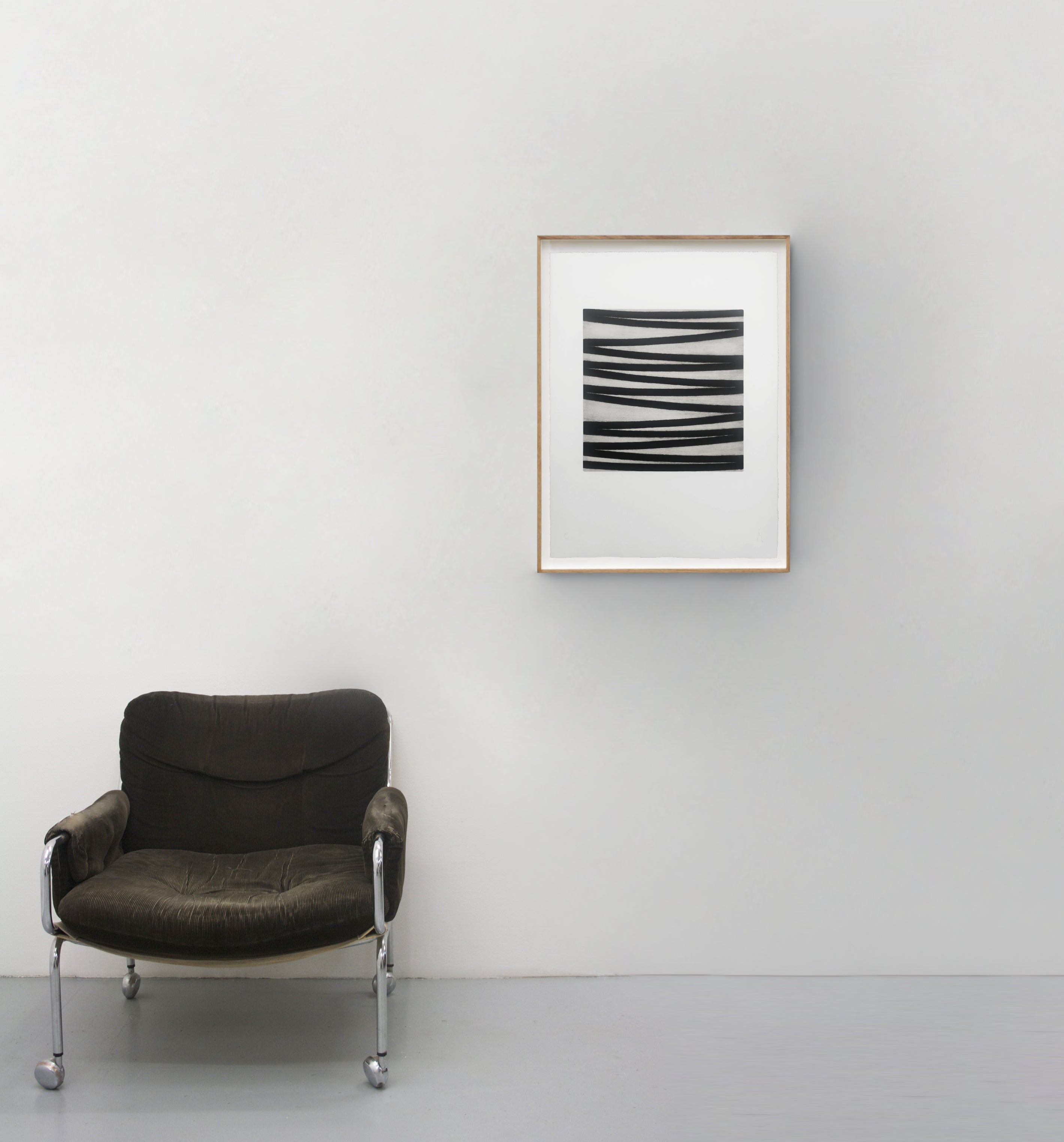 A black and white drawing on a white wall.