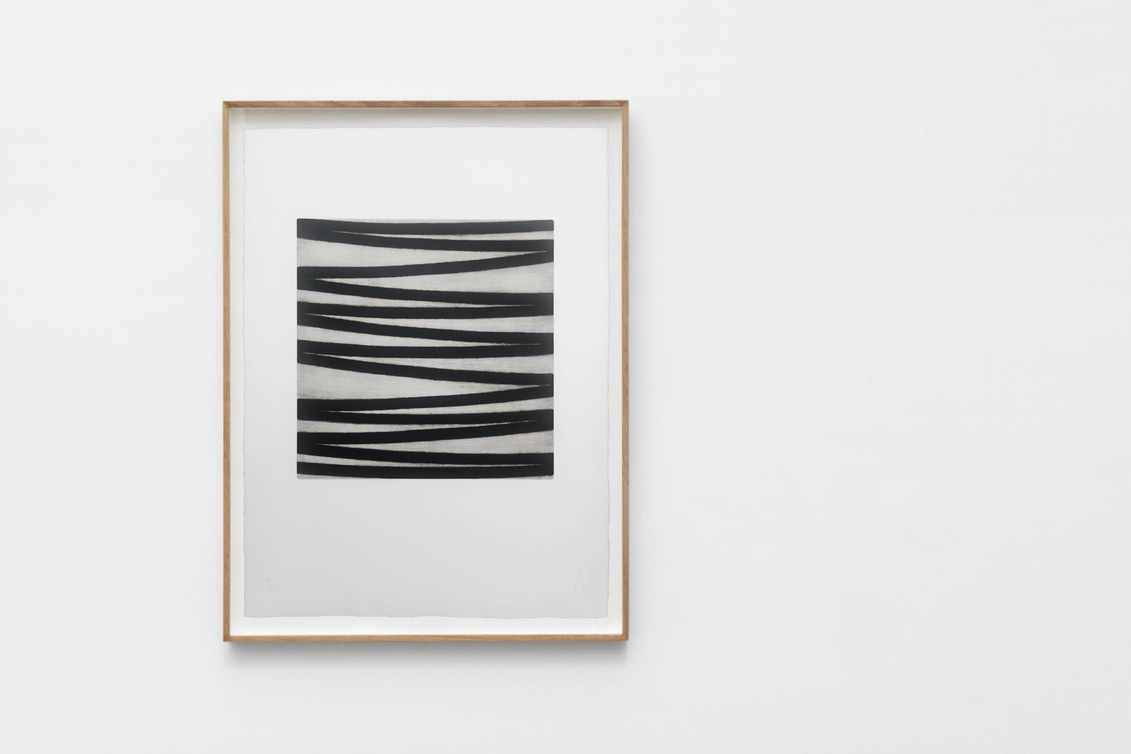 A black and white drawing on a white wall.