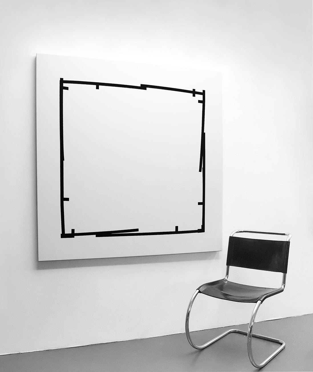 A black and white drawing of a square frame.