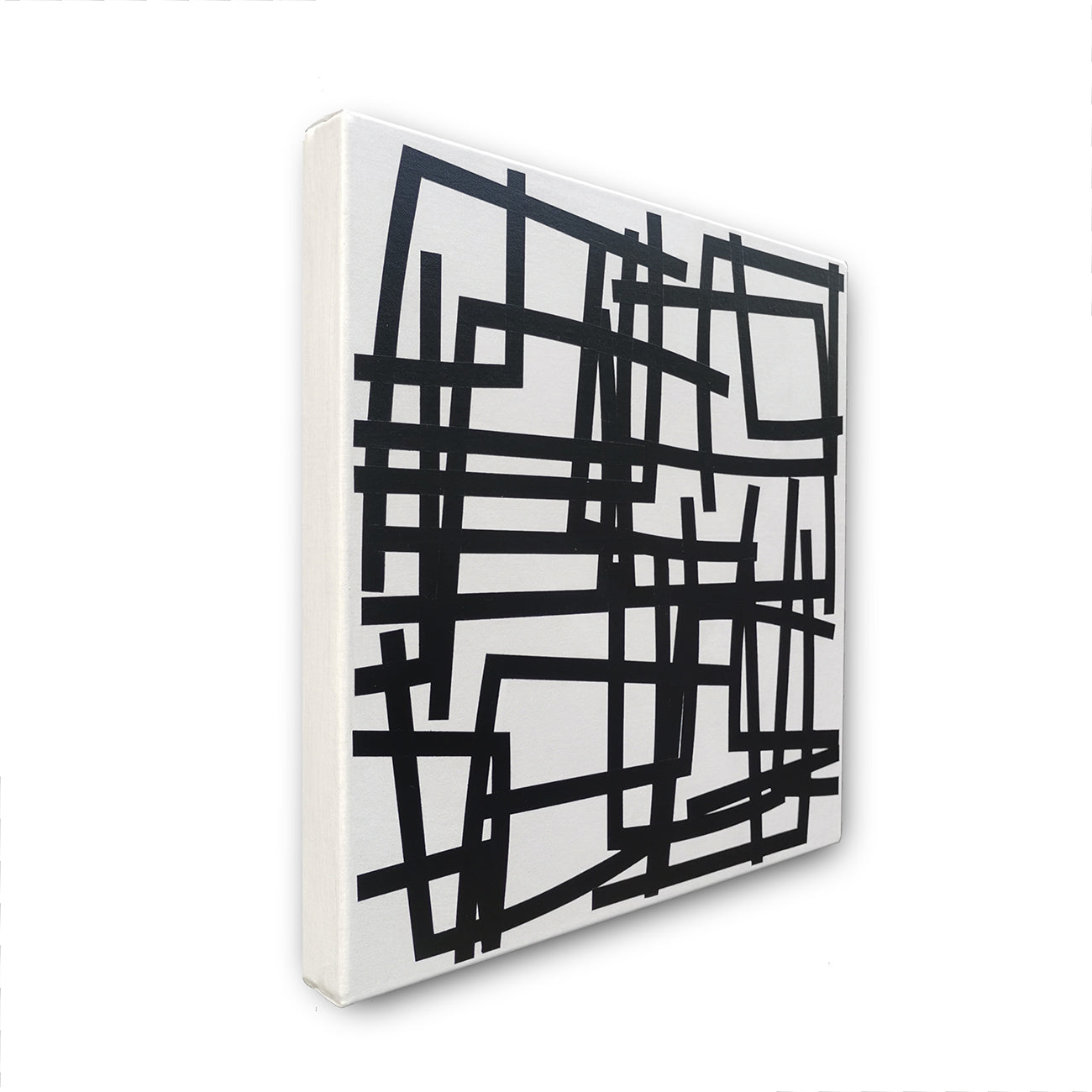 A black and white painting on a white wall.