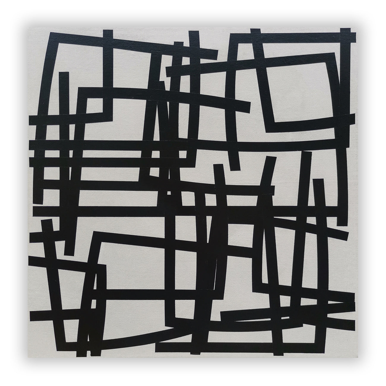 A black and white painting on a white wall.