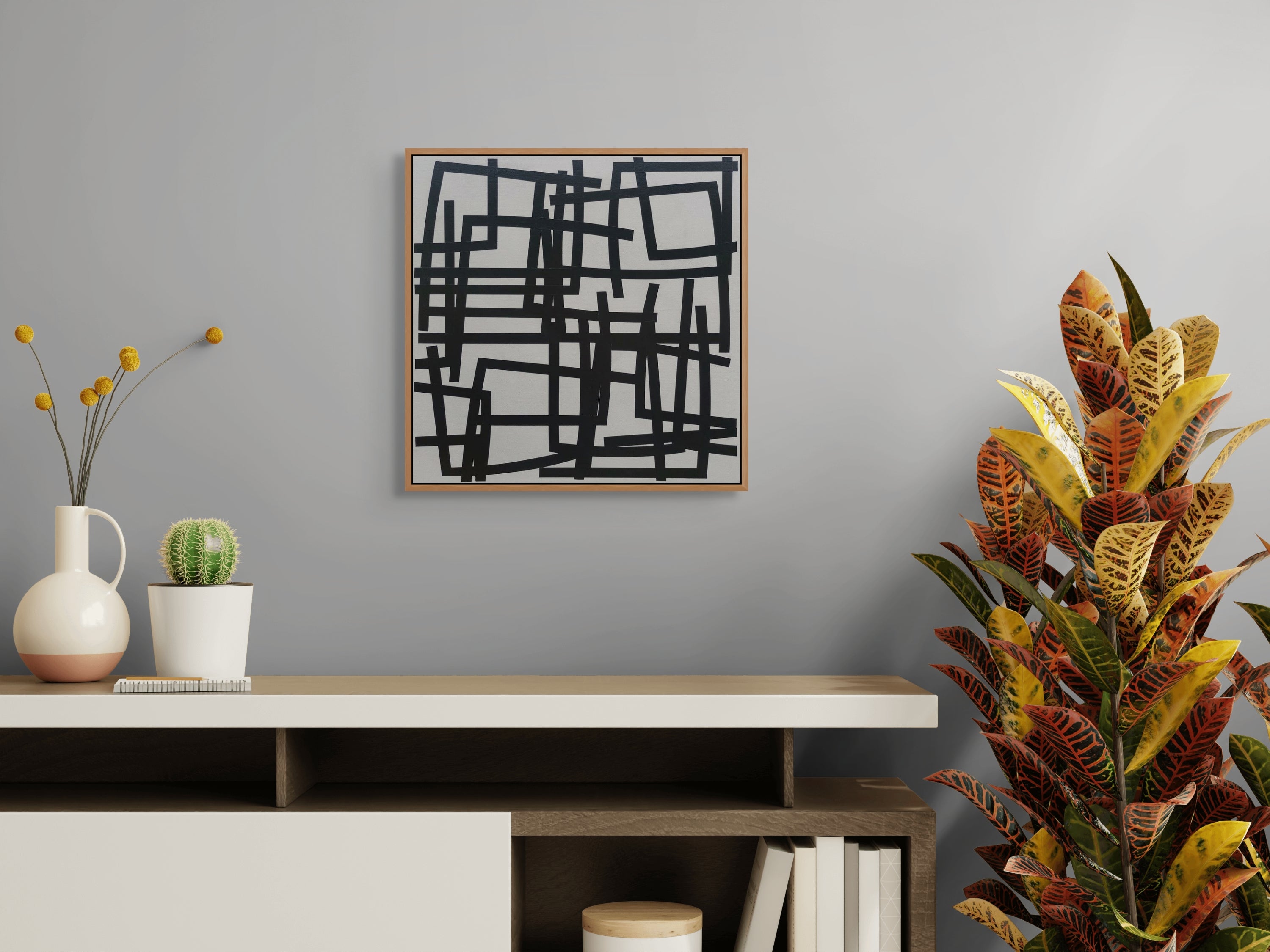 A black and white painting on a white wall.