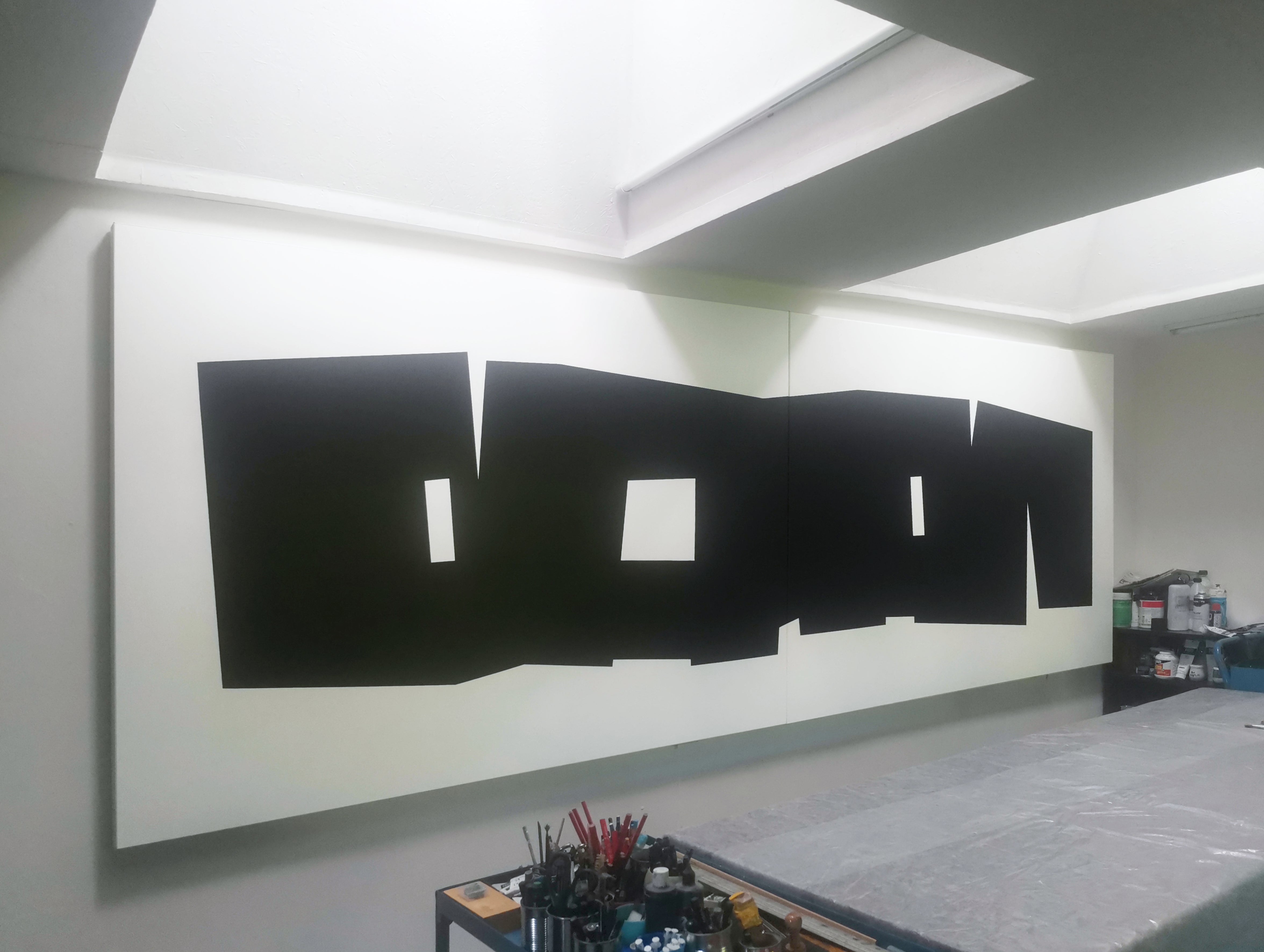 A black and white poster with the word DON cut out of it.