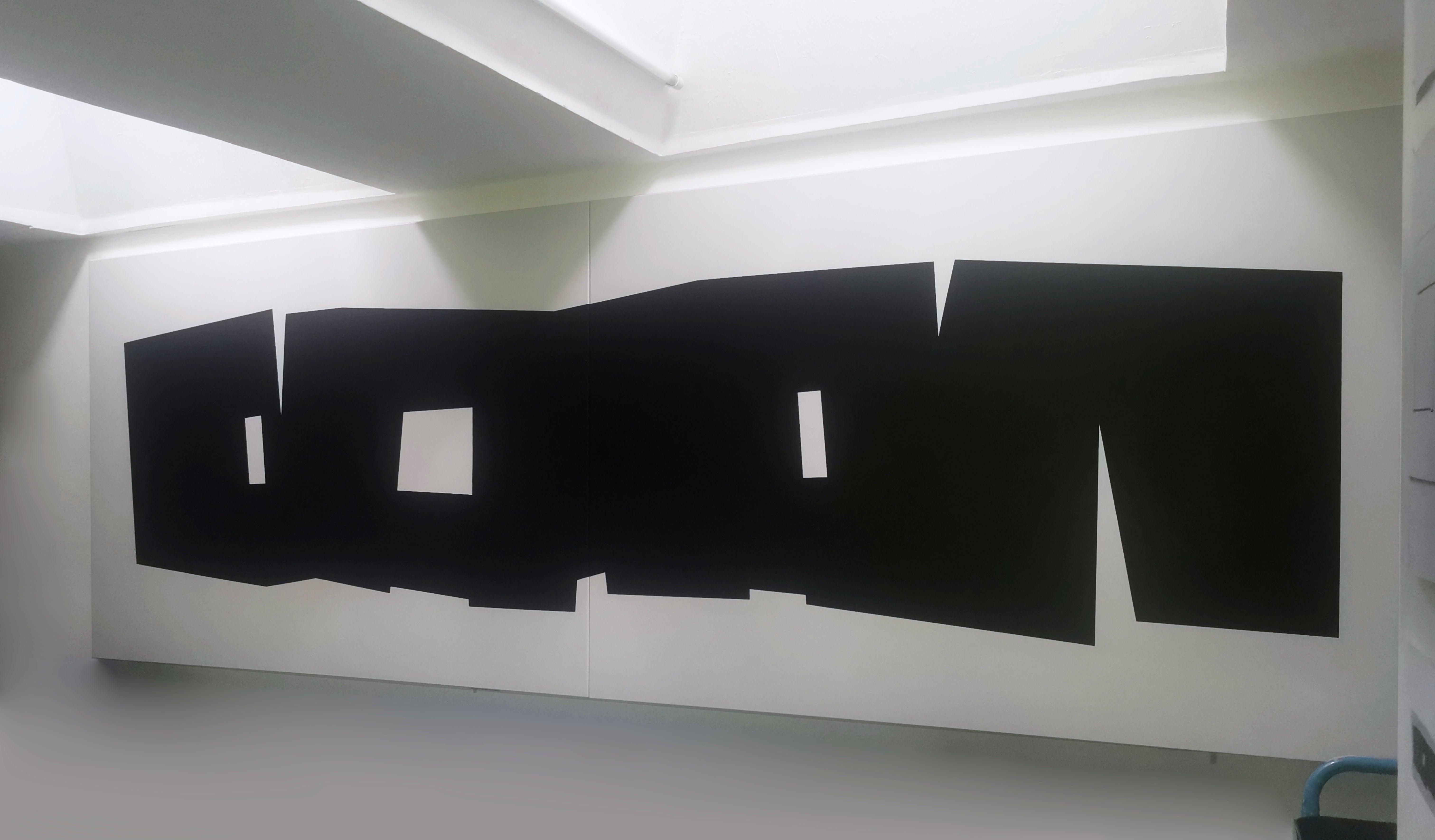 A black and white poster with the word DON cut out of it.