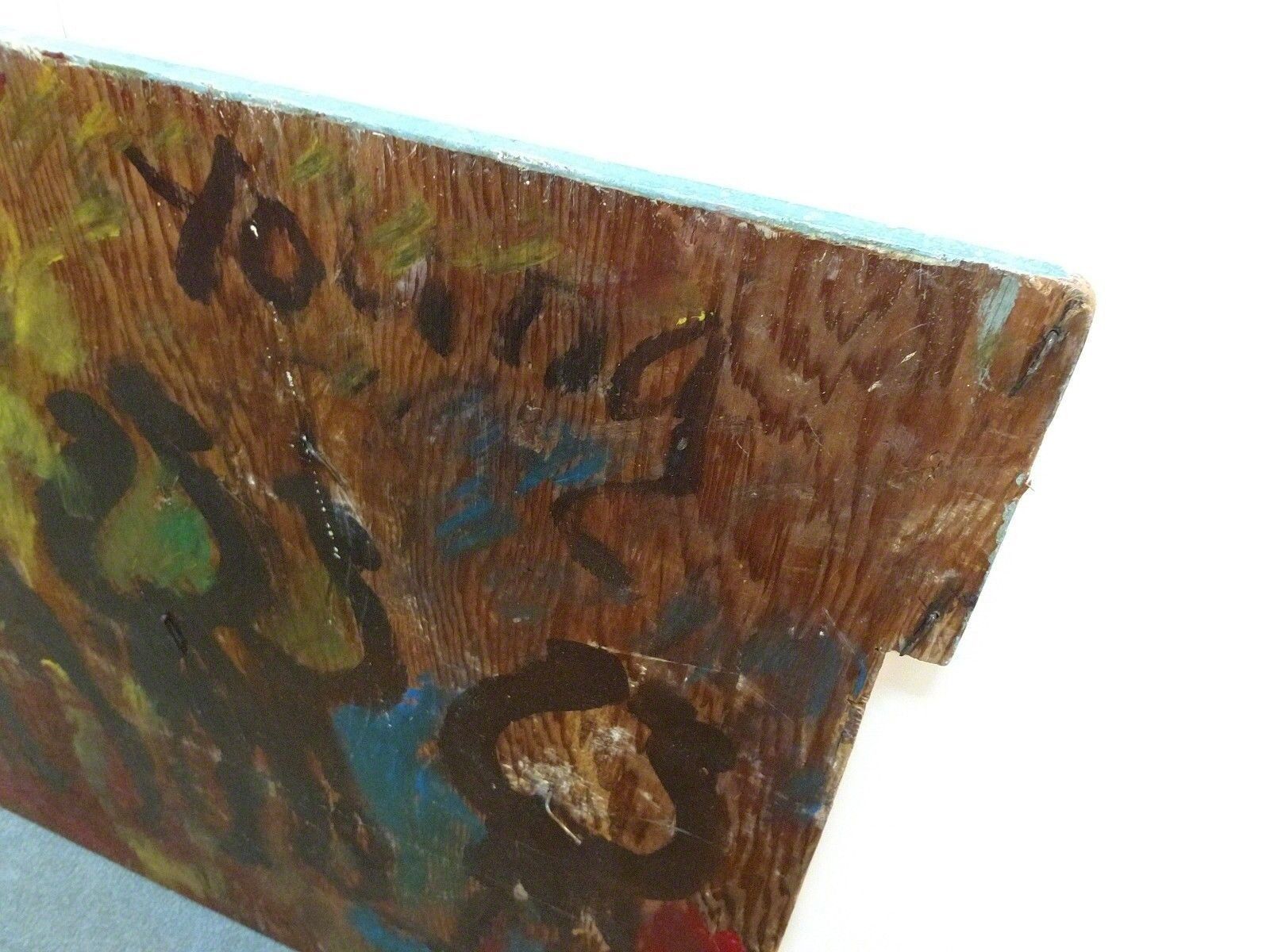 A painting of a group of people on a wooden surface.