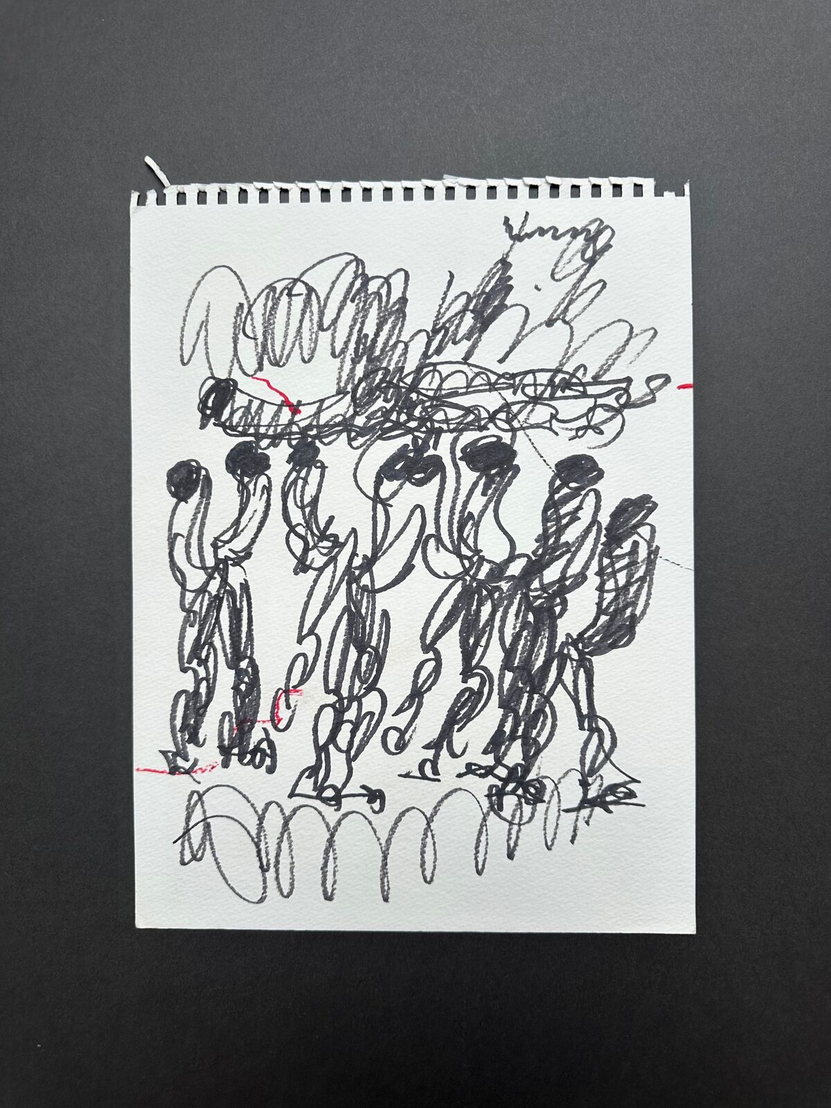 A drawing of a group of people holding hands in the air.