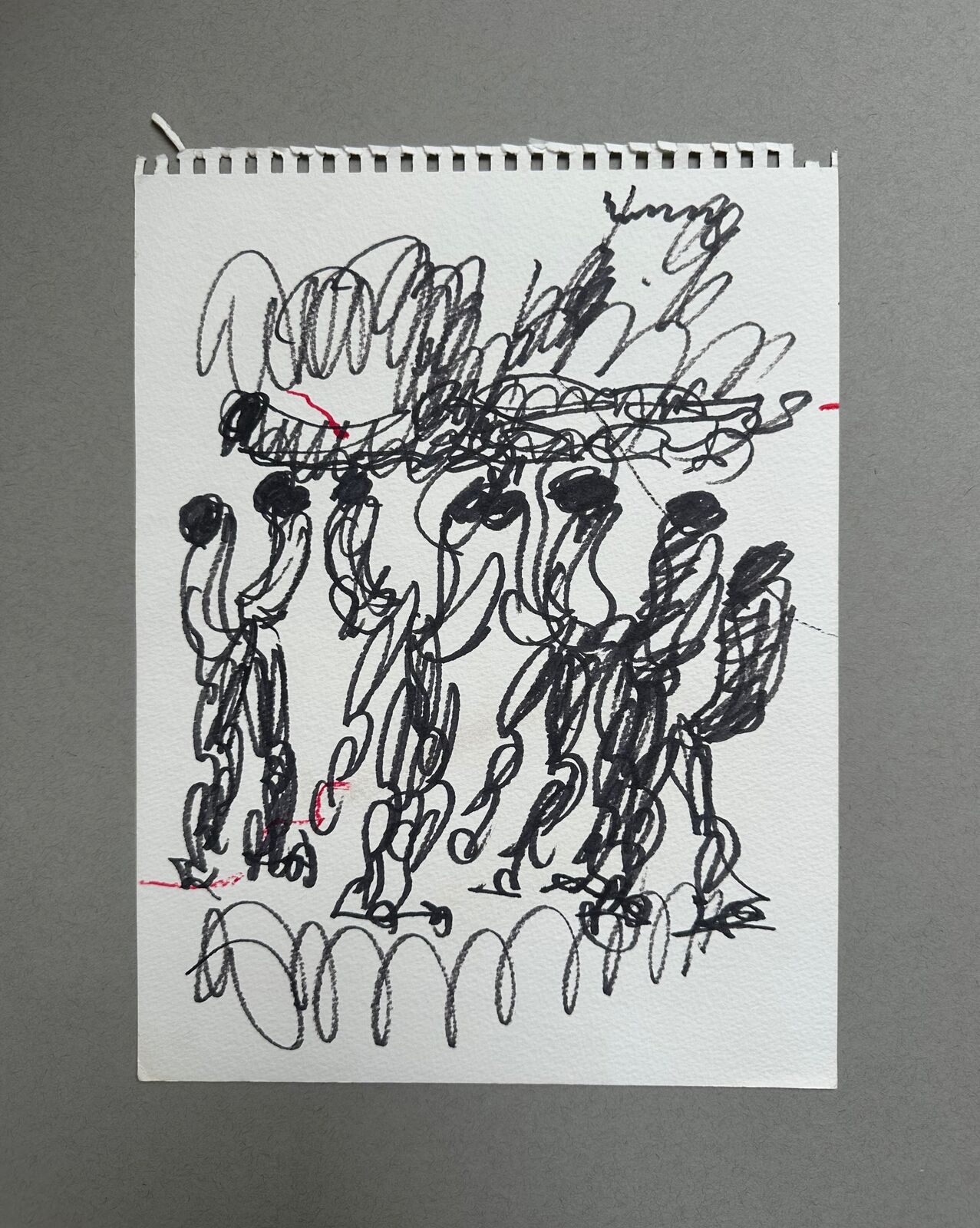 A drawing of a group of people holding hands in the air.