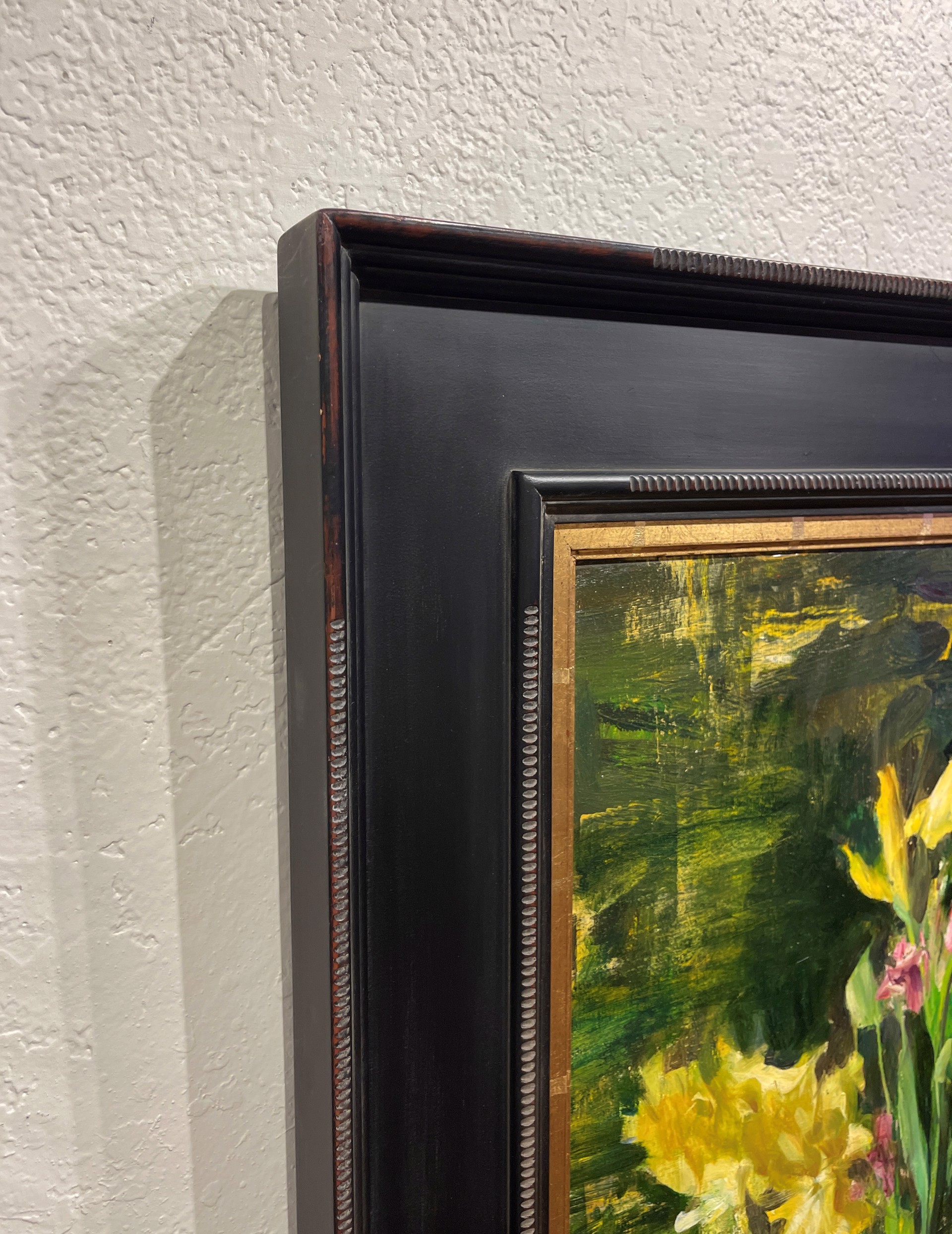 A painting of yellow flowers in a vase on a table.