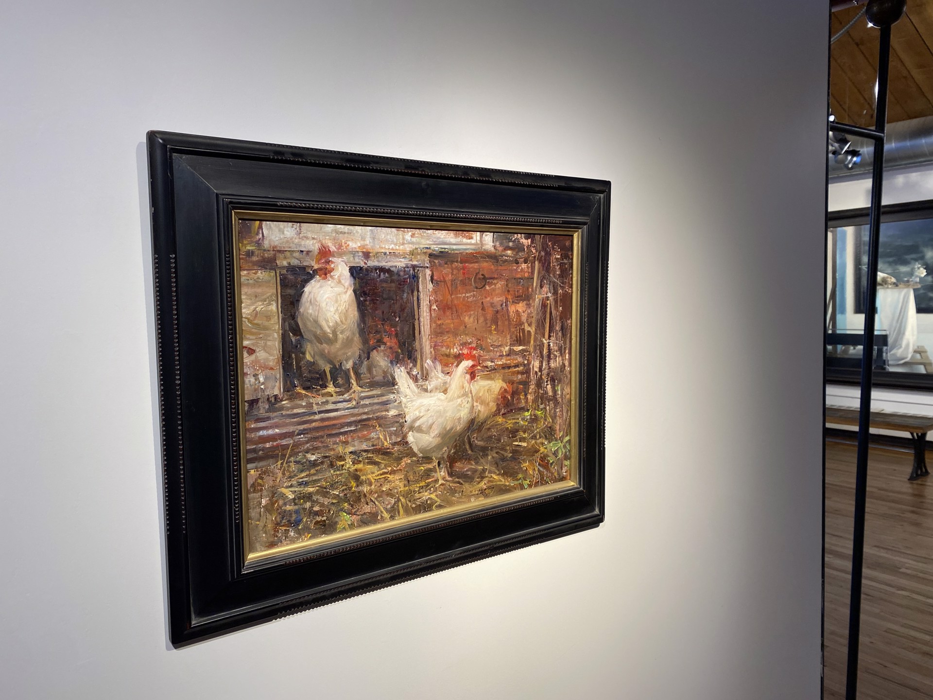 A painting of two white chickens standing in a barn.