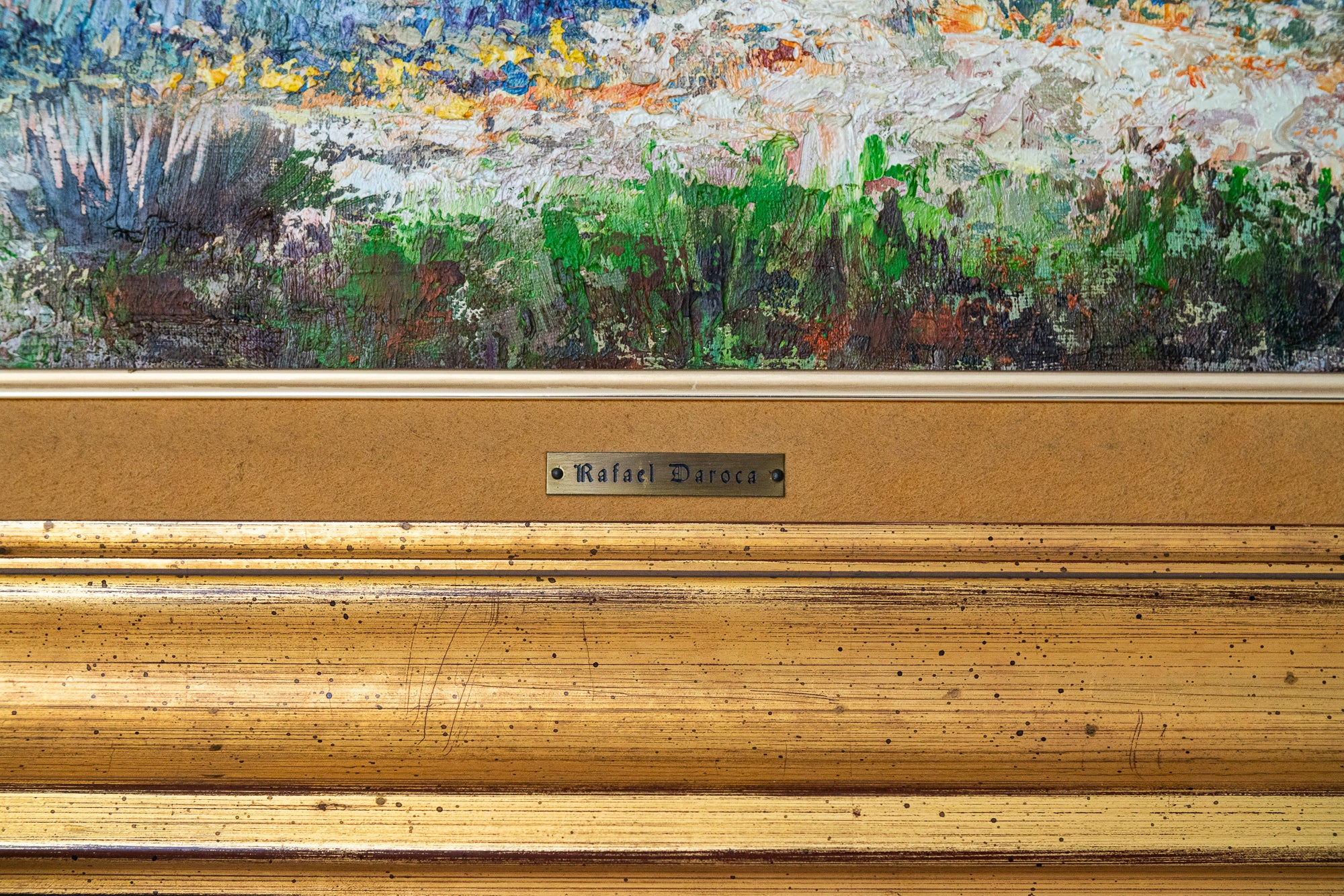 A painting of a landscape with a church on a hill.