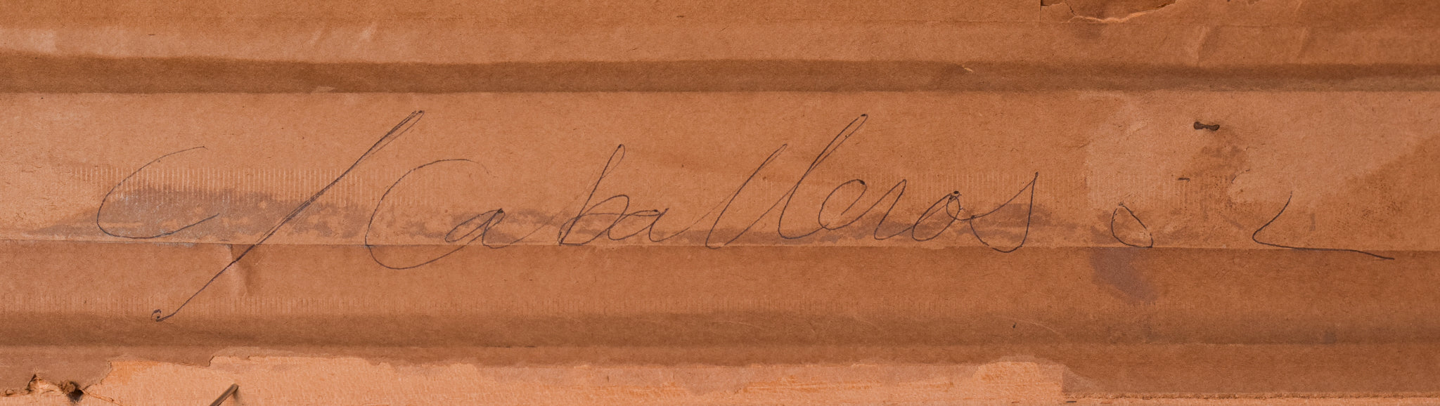 A painting of a woman sitting at a table with a book and a vase of flowers.