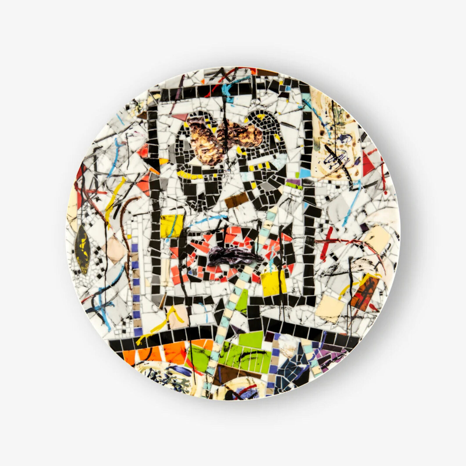 A plate with a mosaic design on it. 