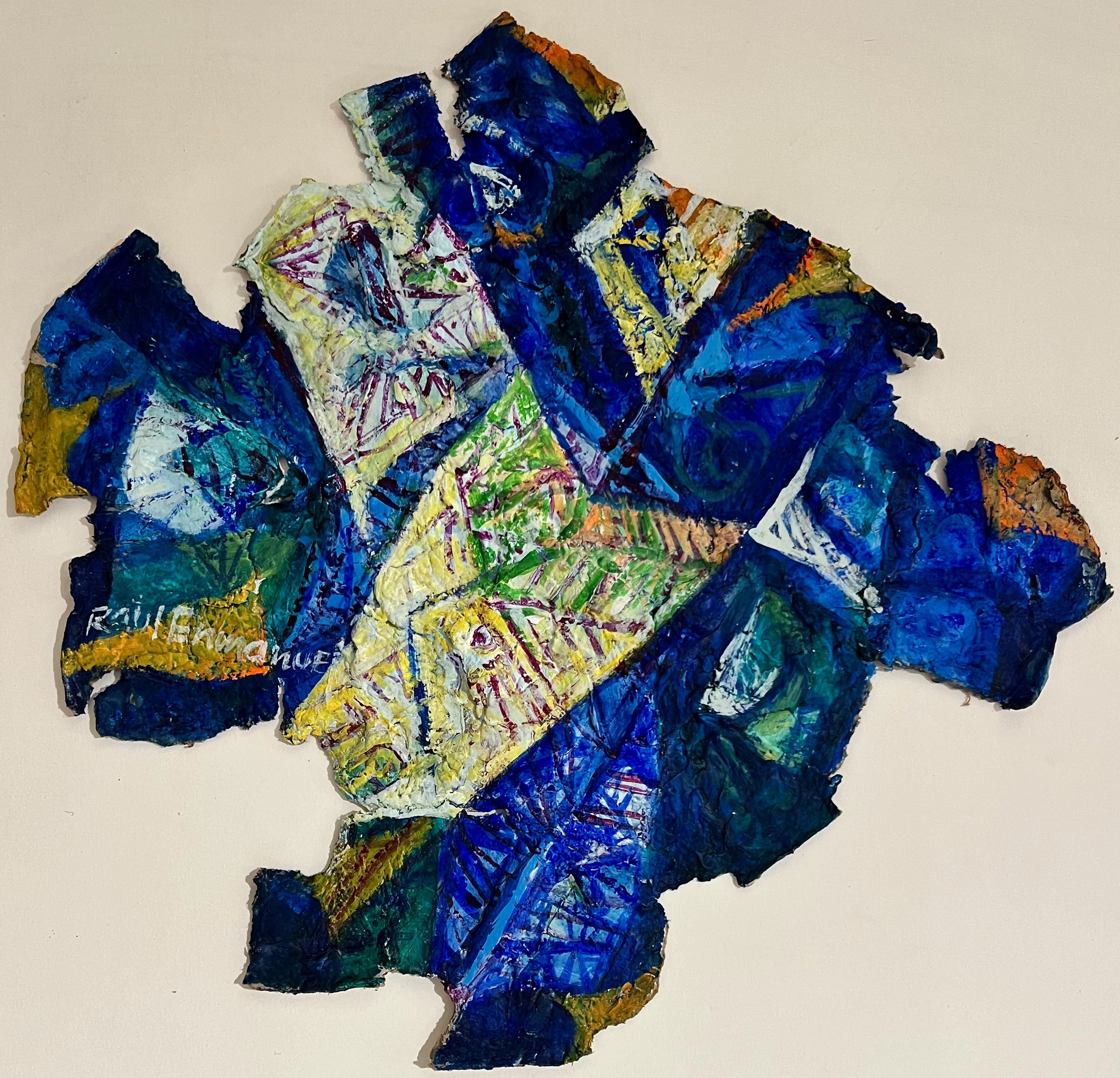 A piece of blue and yellow paper on a white surface.