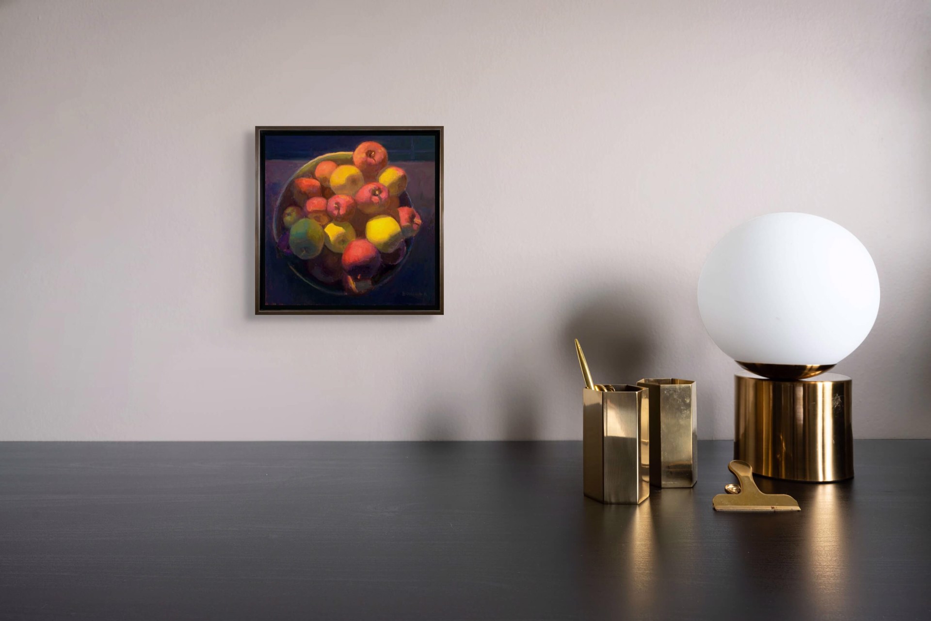 A painting of apples and lemons in a bowl on a table.