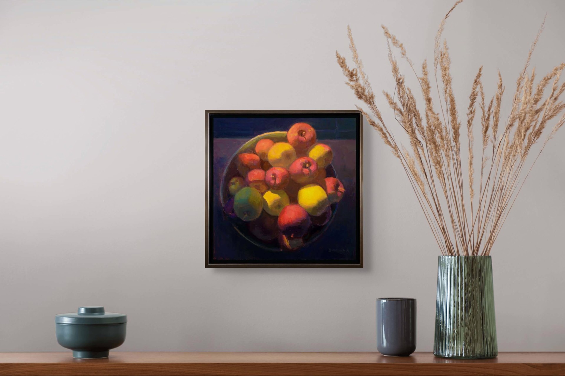 A painting of apples and lemons in a bowl on a table.