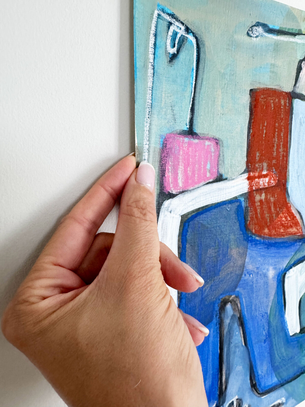 A colorful abstract painting of a chair with bold brushstrokes and a white outline frame.