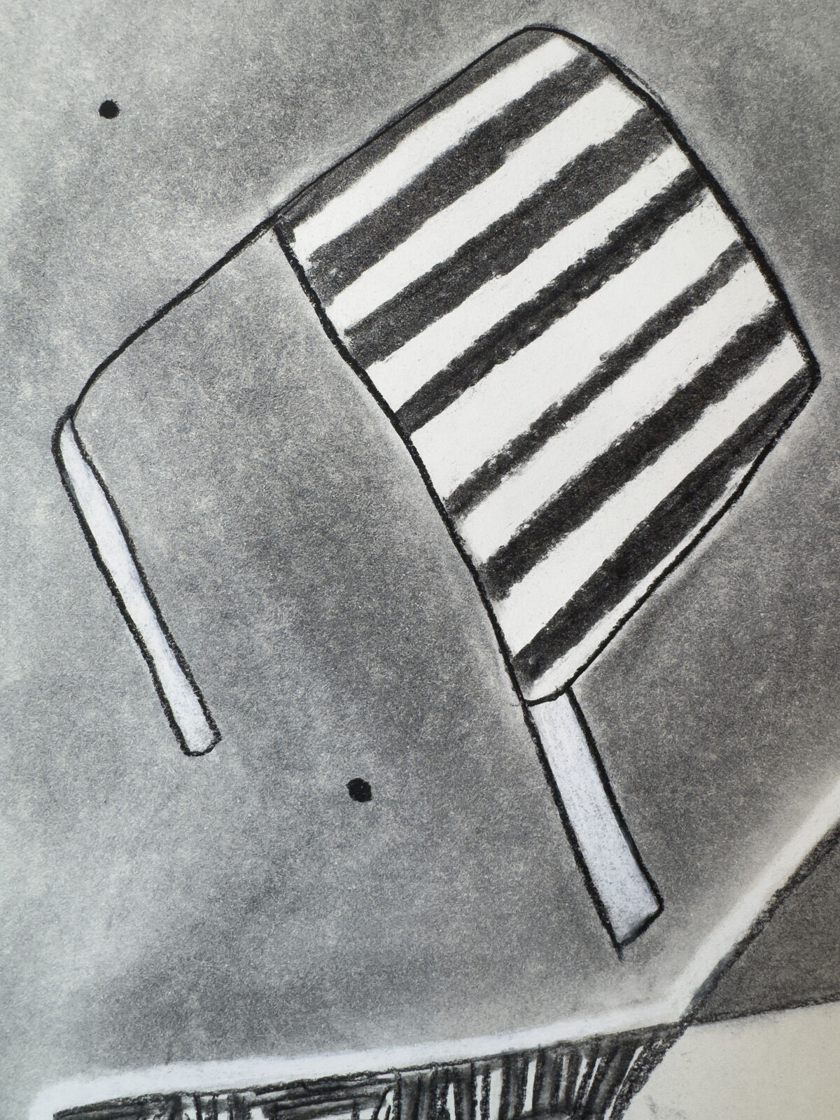 A monochromatic drawing of a still life featuring a striped chair, a book, and a pen on a gray background.